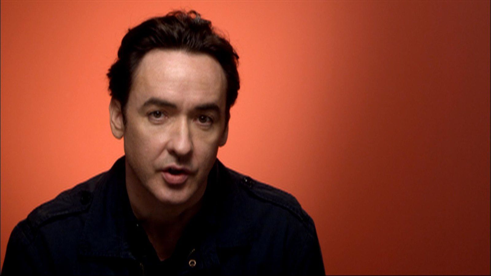 1600x900 john cusack. Brave New Films