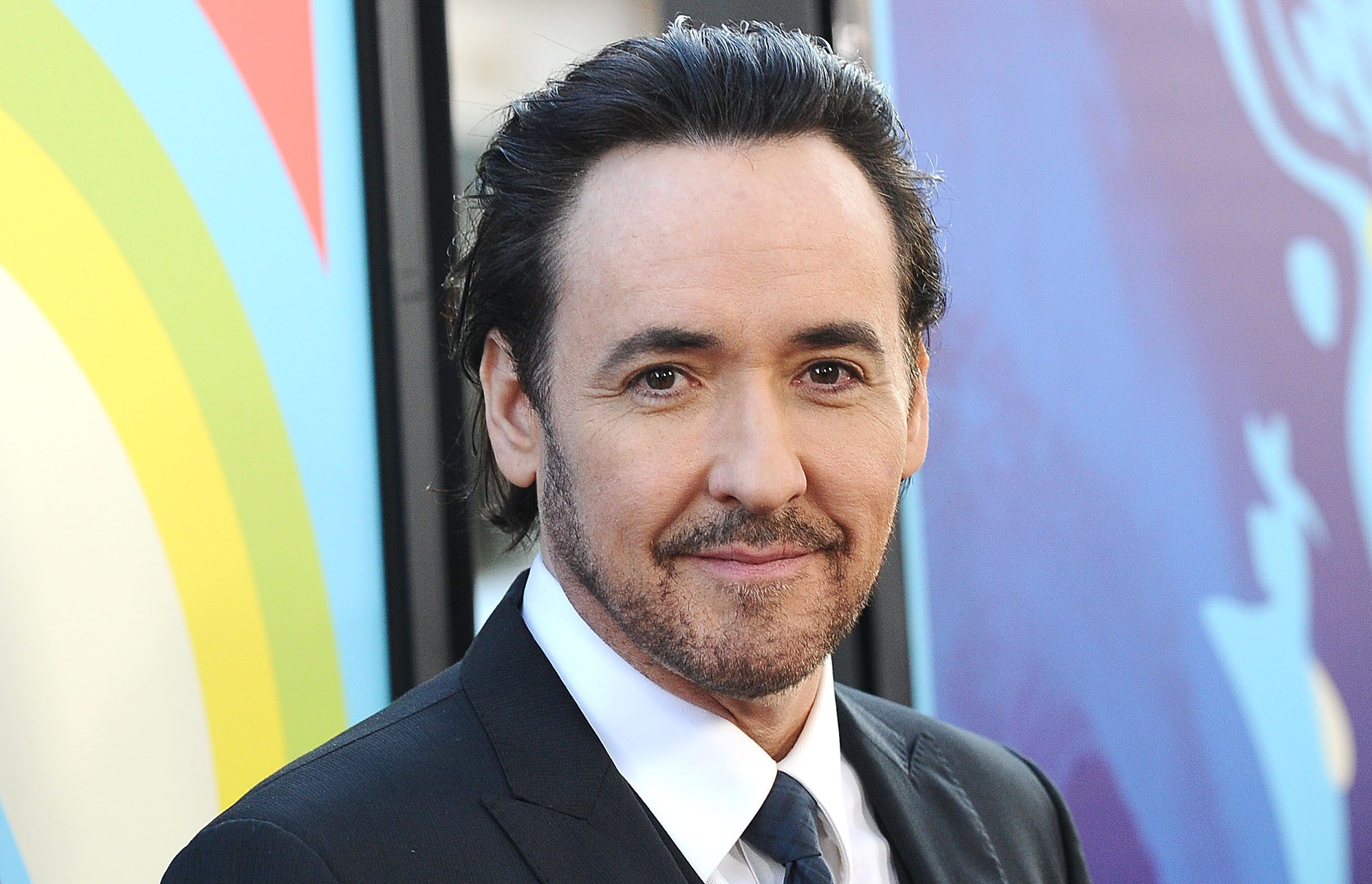 2435x1570 John Cusack Then & Now: Photo of the 'Say Anything' Star Over the Years