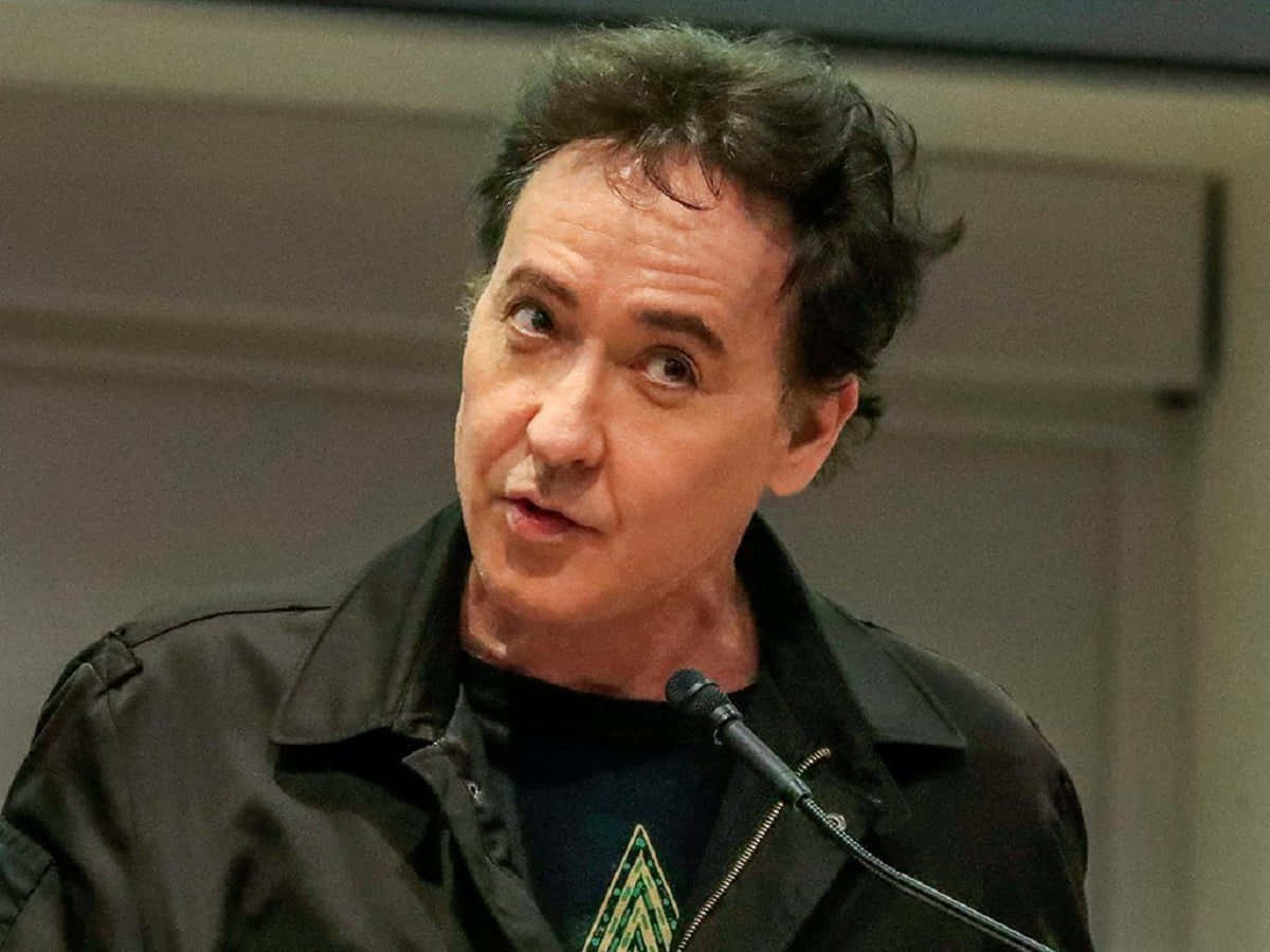 1200x900 Download John Cusack, The Iconic Actor, Poses In A Thought Provoking Stance. Wallpaper