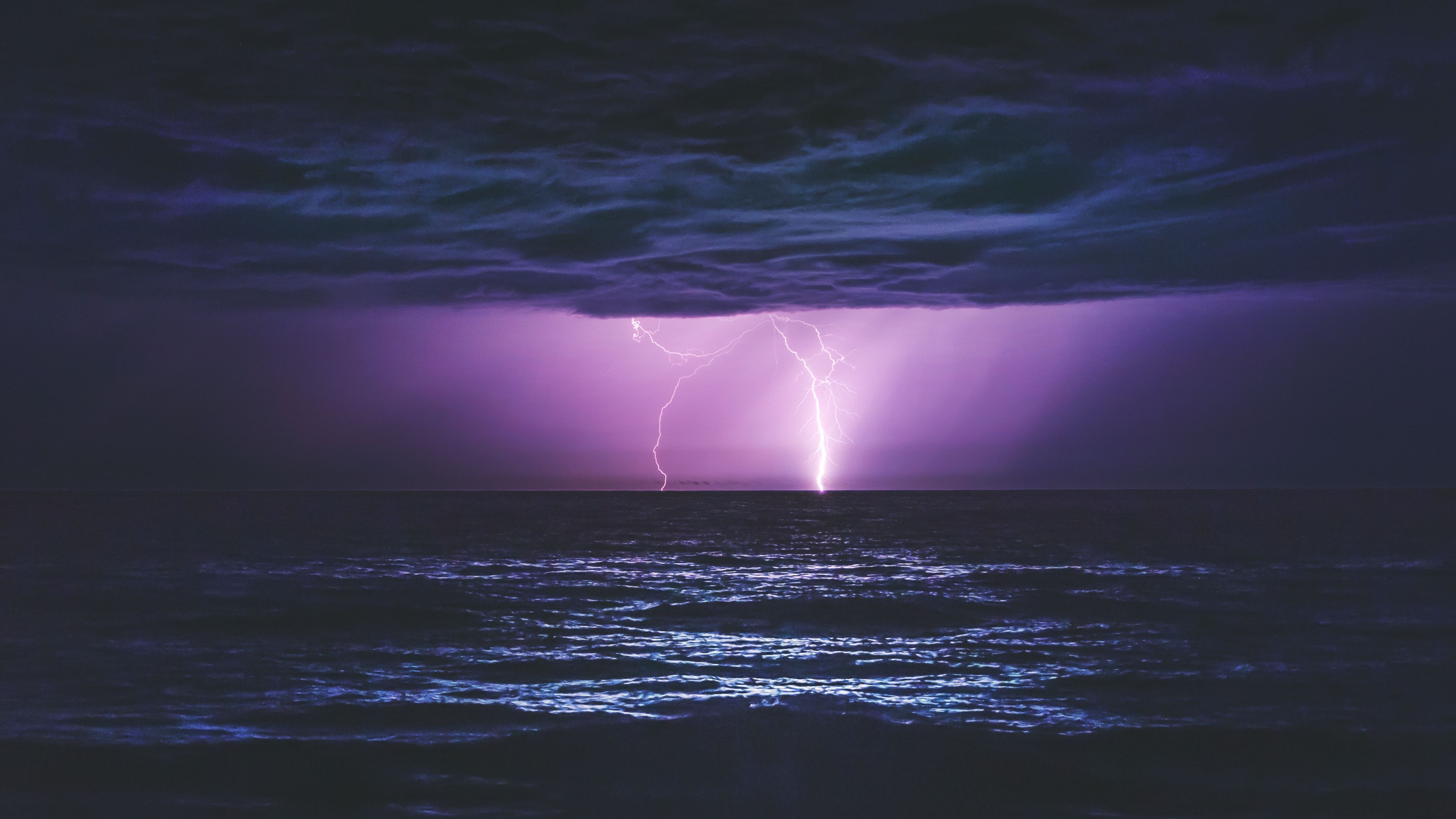 3840x2160 Thunder Sea Night Lightning Clouds Ocean View Light Purple Sky 4K HD Nature Wallpaper