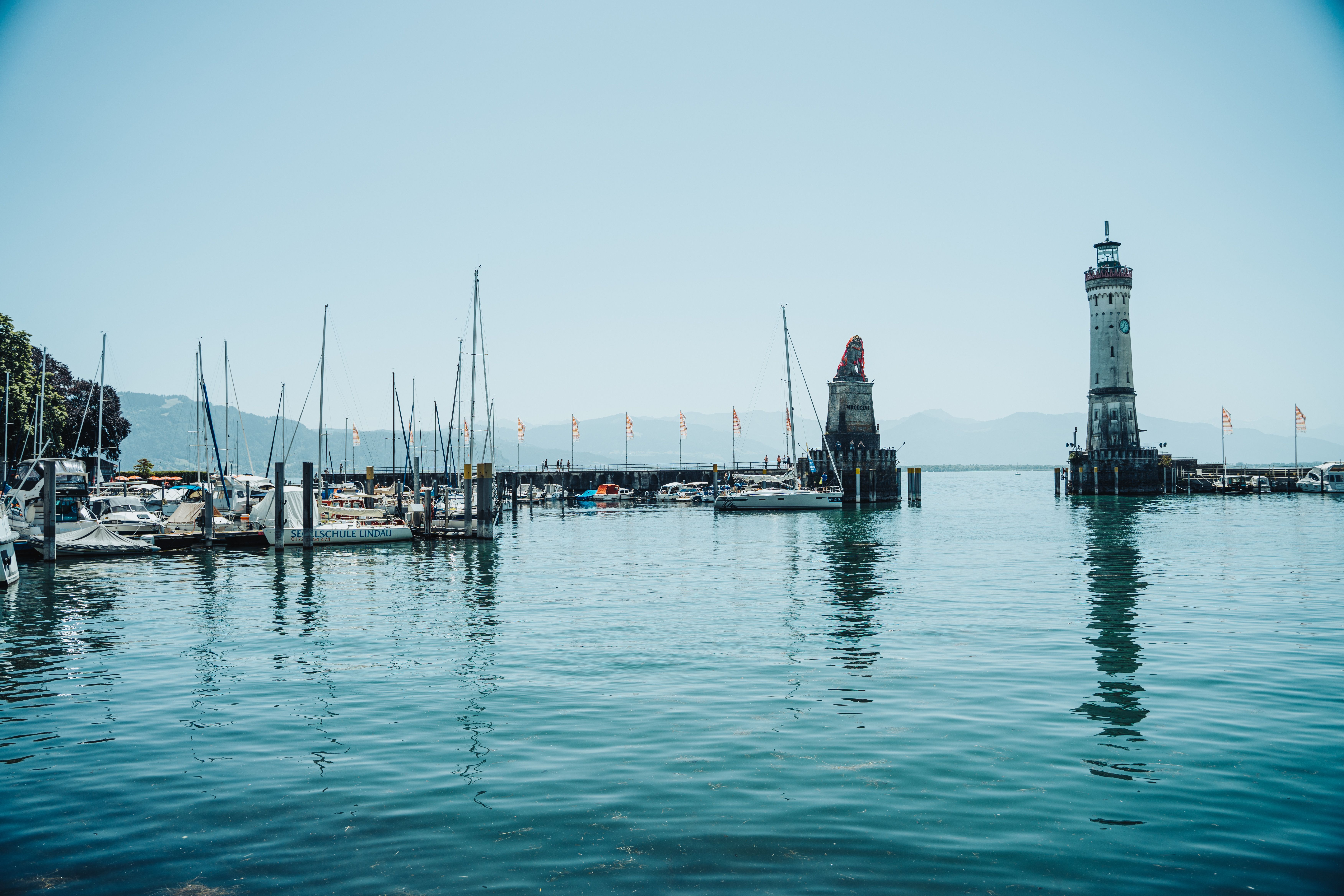7008x4672 The Lindau Lighthouse and the Bavarian Lion on Lake Constance · Free