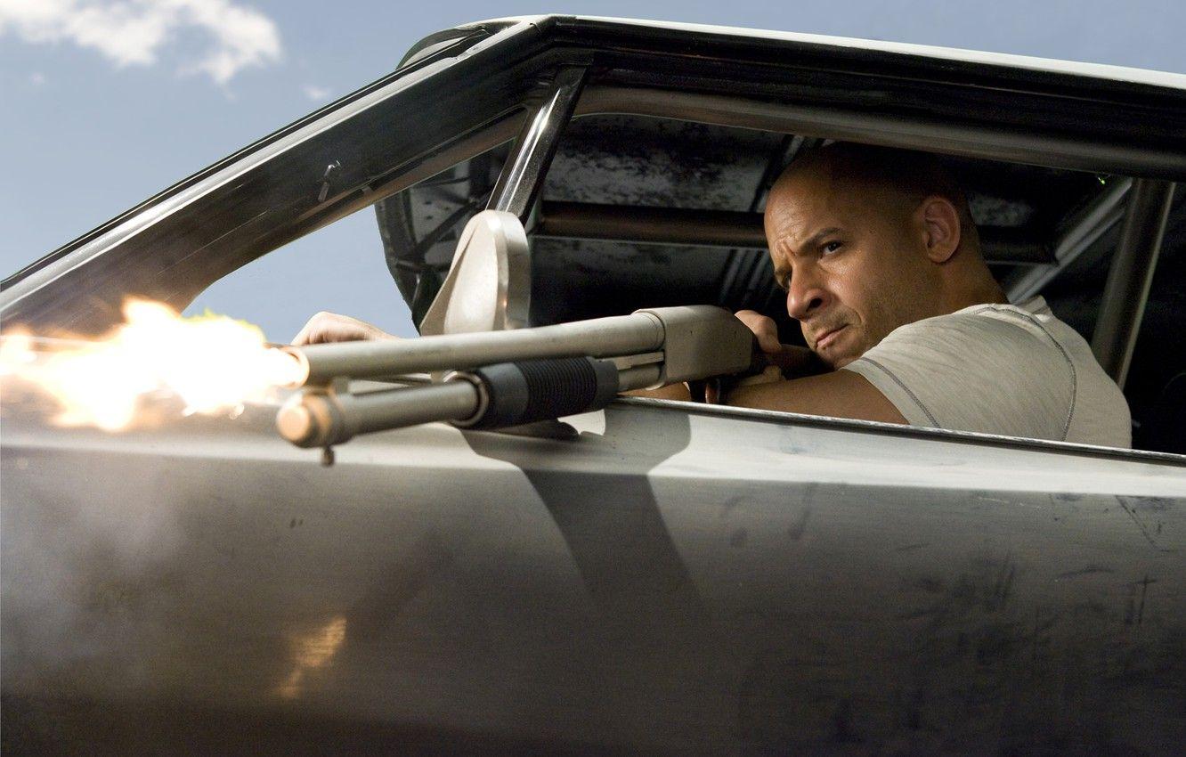 1332x850 Wallpaper weapons, man, actor, VIN Diesel, shotgun, Vin Diesel