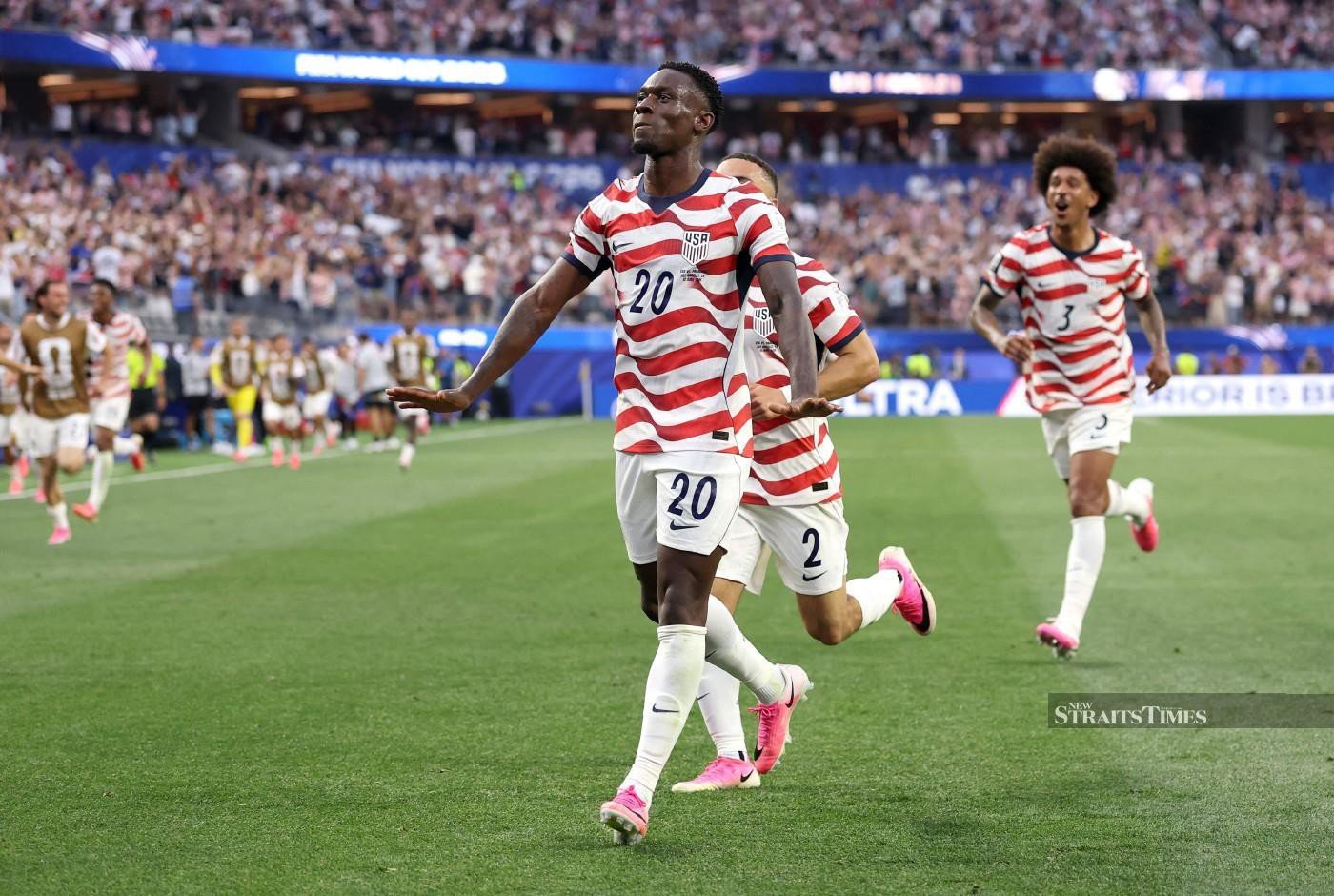 1400x940 Balogun brace fires US to win in World Cup opener