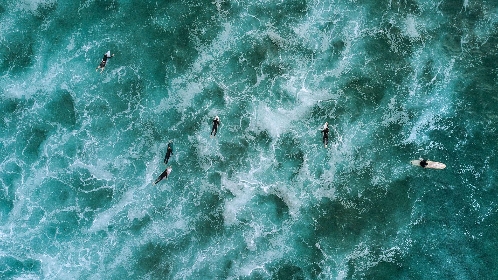 1920x1080 drone shot of surfers