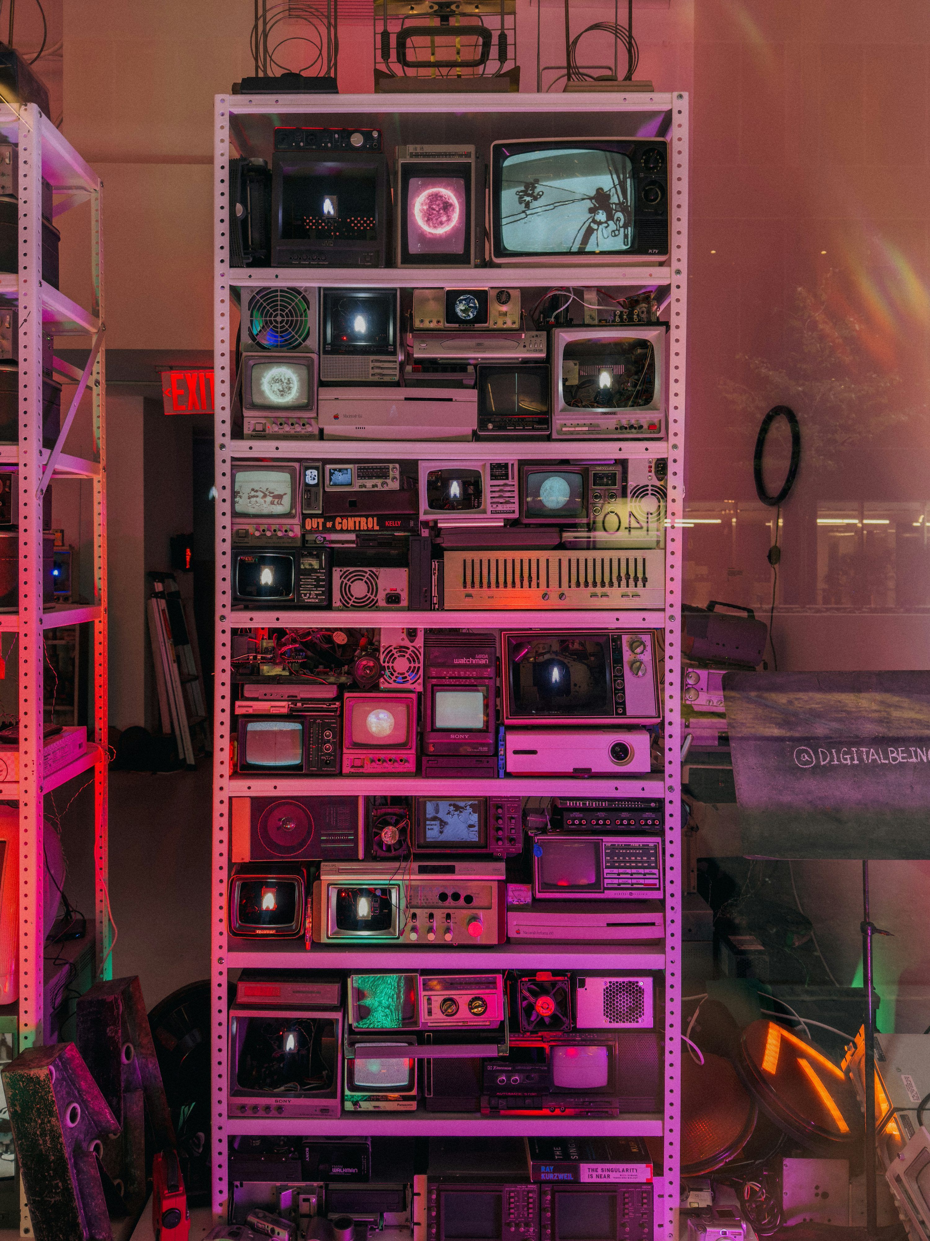 3000x4000 Shelf filled with vintage televisions and electronics photo