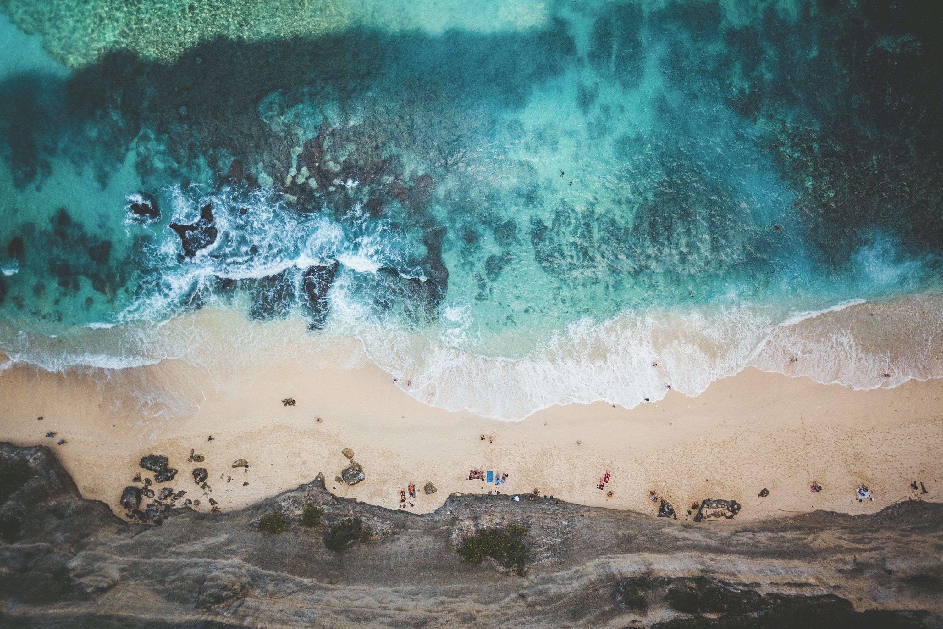 3000x2000 Aerial view of people on beach during daytime photo