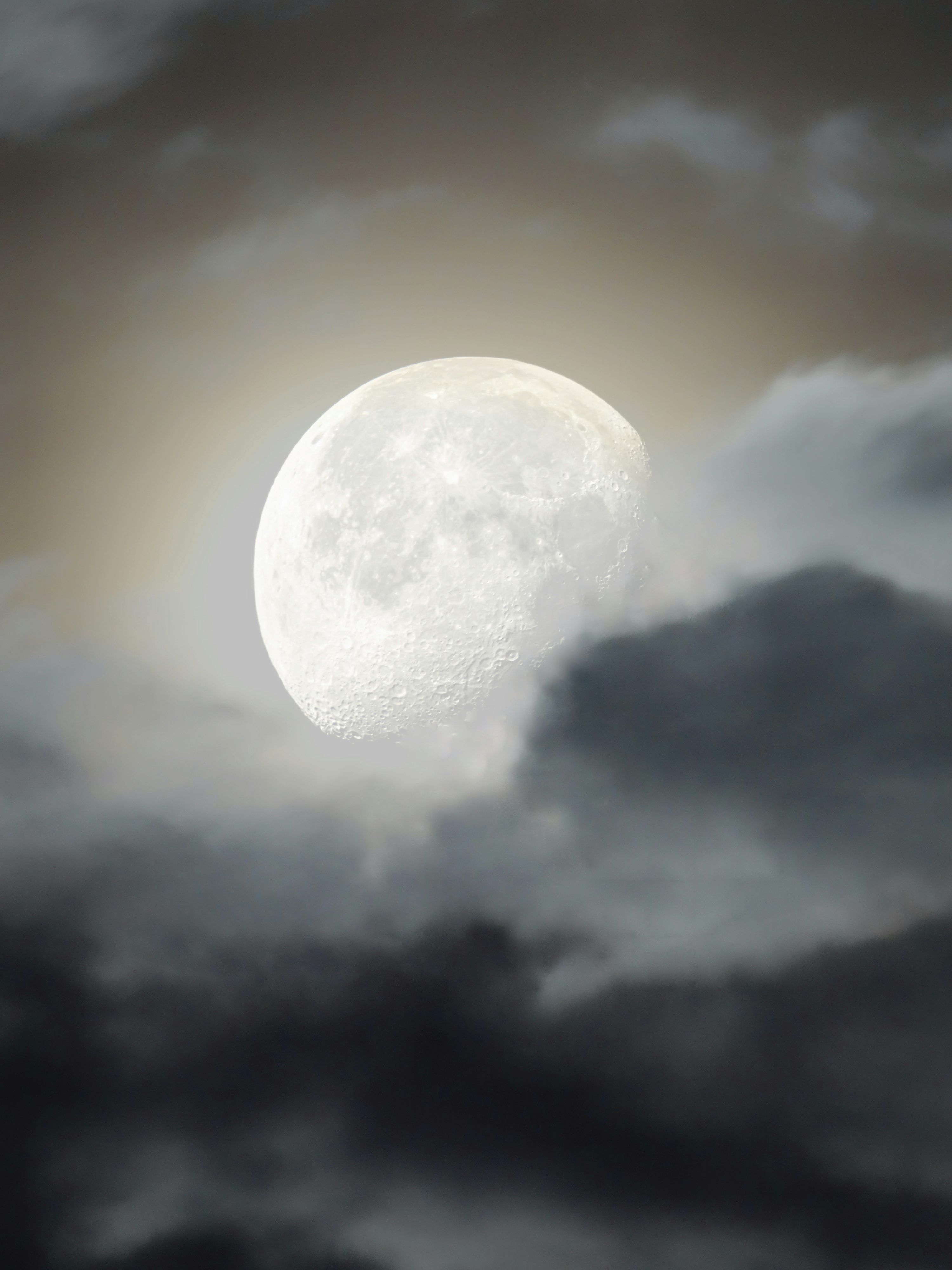 3000x4000 A full moon seen through a cloudy sky photo
