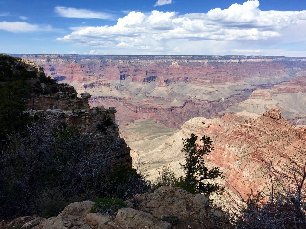 1024x768 A view of the grand canyon from the edge of a cliff. Grand