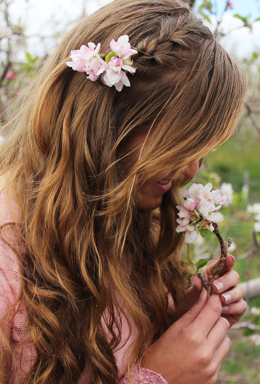 910x1342 HD wallpaper: woman holding pink flowers, girl, portriat, young, lady, smile