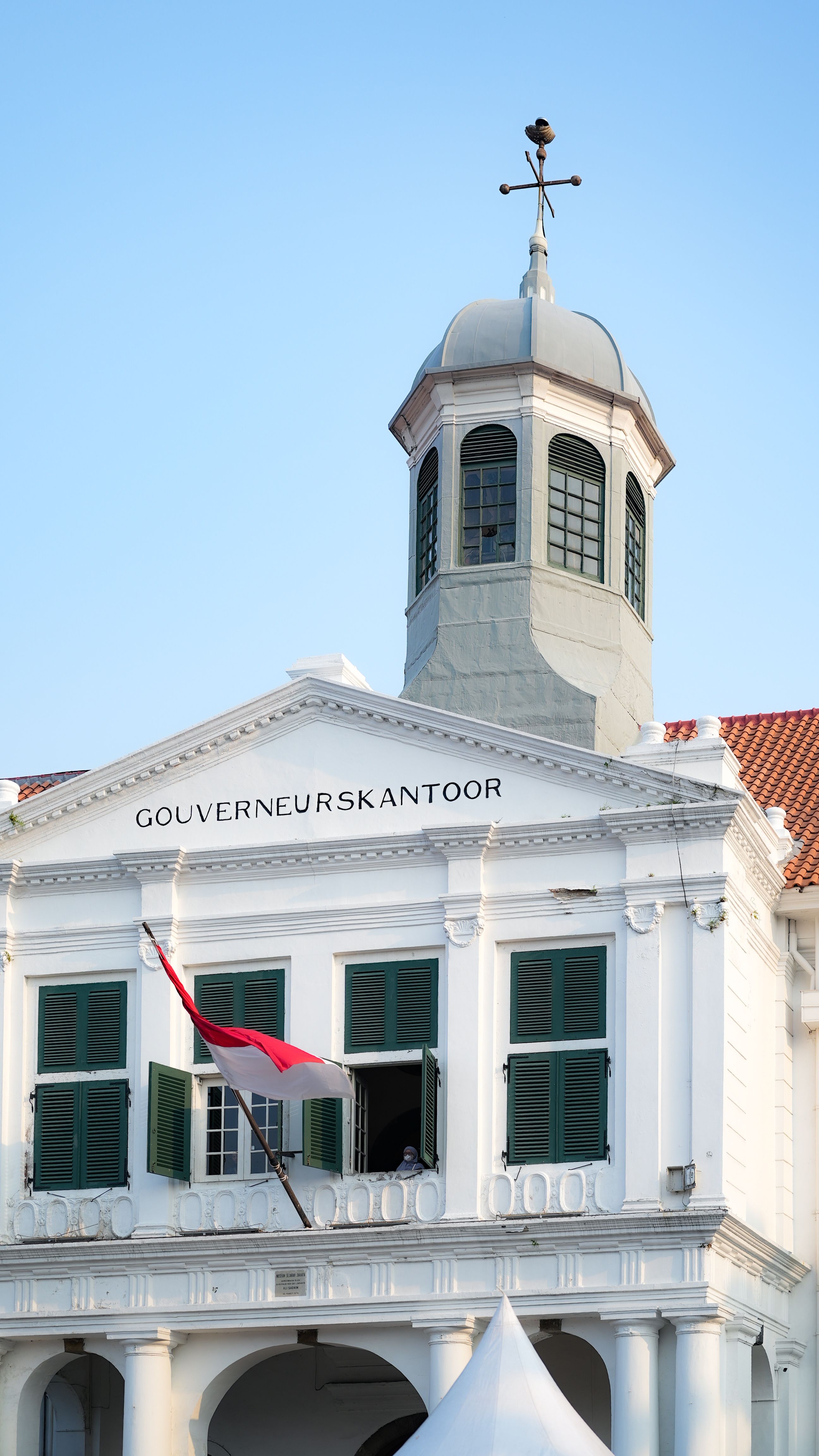 2592x4608 An Indonesian Flag Hanging from a Government Building · Free