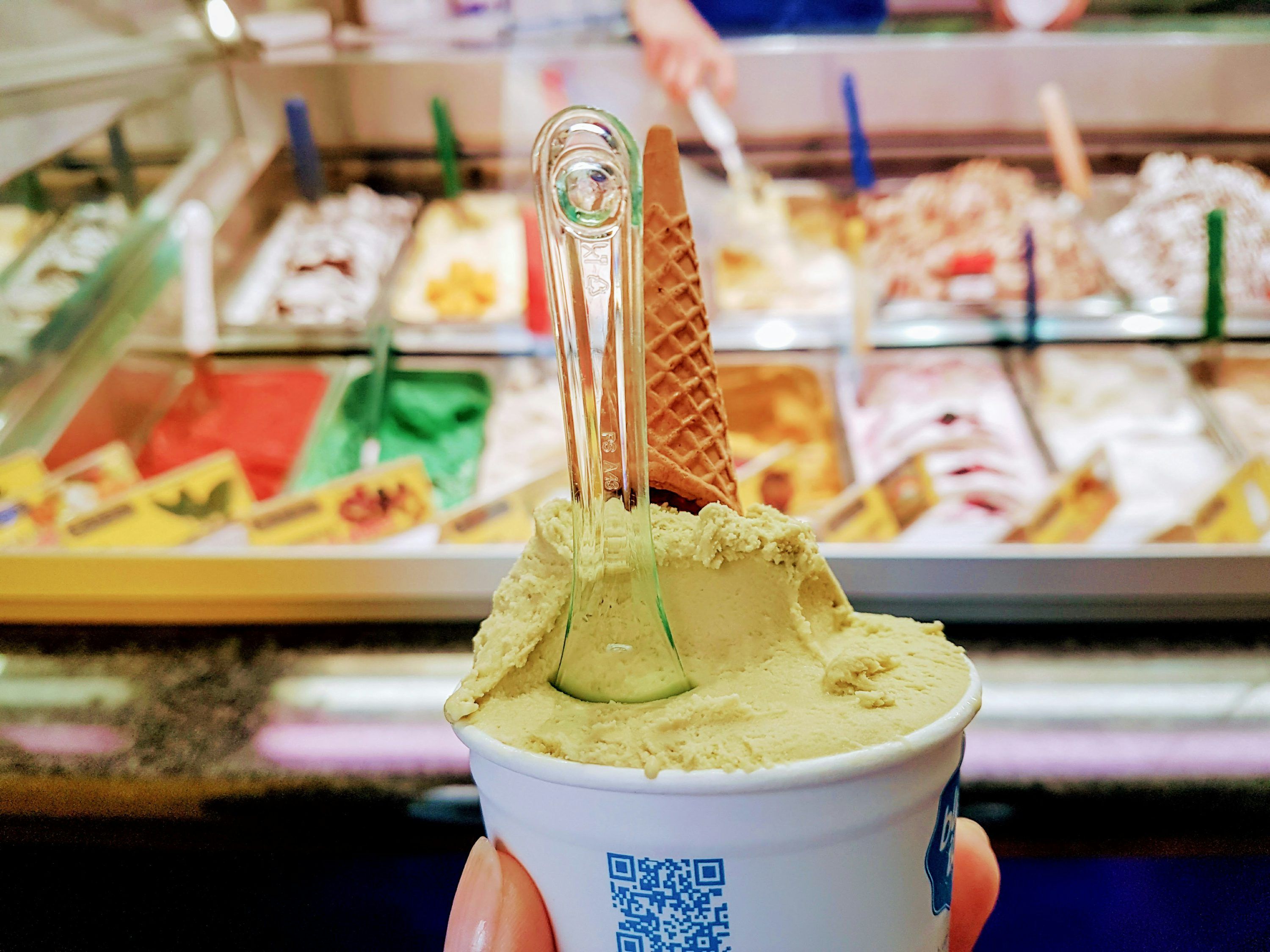 3000x2250 A person holding a cup of ice cream photo