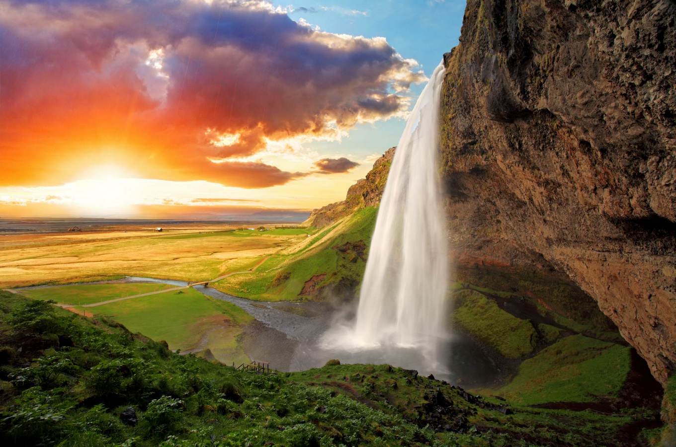 1360x900 Wallpaper Waterfall in the mountains against the background of a