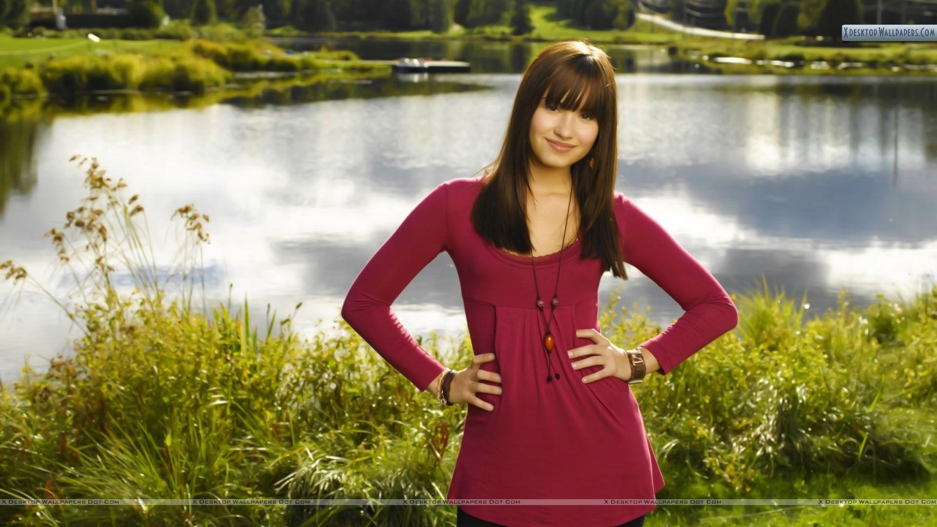 1920x1080 Demi Lovato Outdoor Photohoot Red Dress Wallpaper