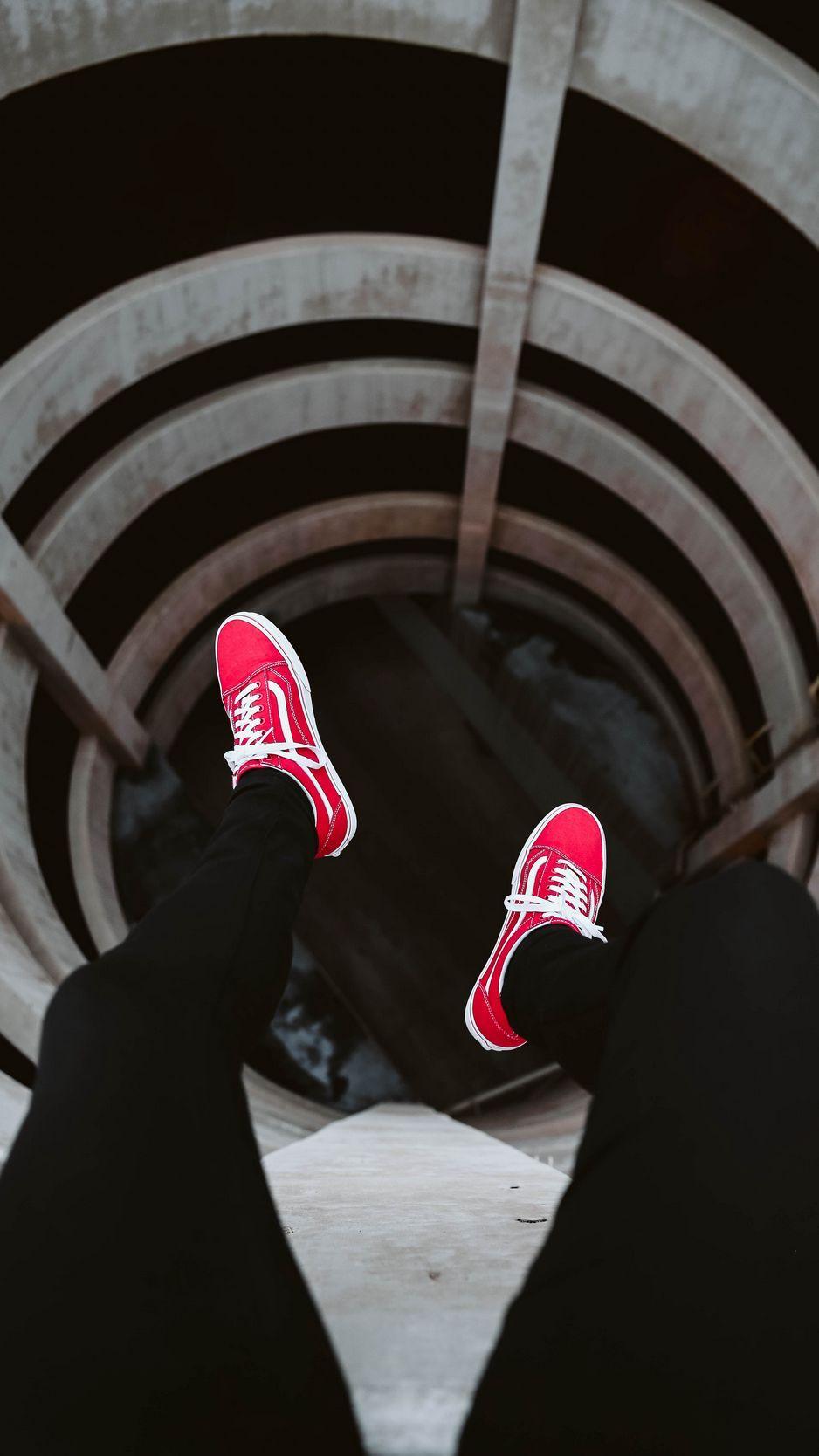 938x1668 Download wallpaper 938x1668 legs, tunnel, shoes, red, sneakers