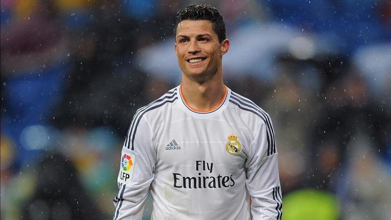 1366x768 Smiley Cristiano Ronaldo CR7 Is Wearing White Sports Dress Standing In Blur Background HD Ronaldo Wallpaper