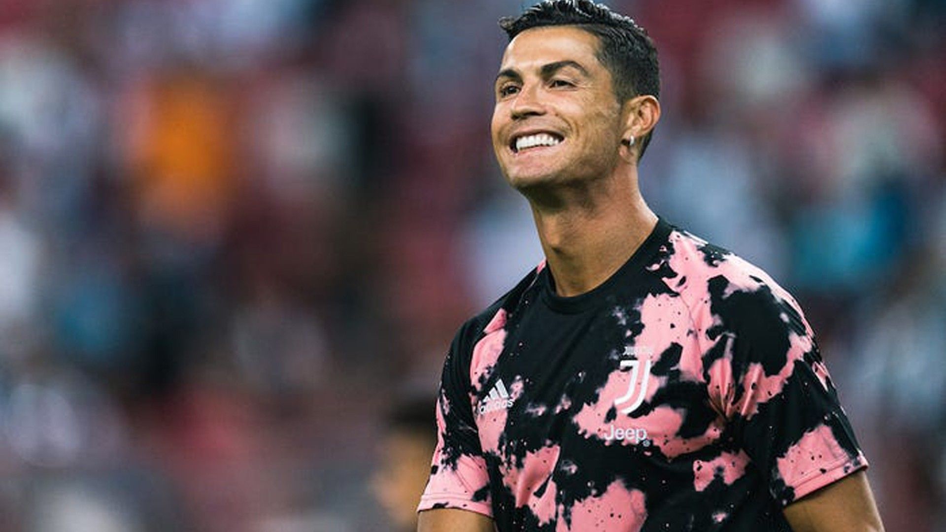 1920x1080 Cristiano Ronaldo CR7 Is Wearing Pink Black Sports Dress Standing In Blur Background HD Ronaldo Wallpaper