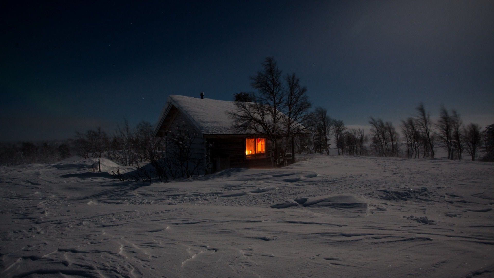 1920x1080 Winter Night Cabin Glow: Cozy Shelter in Snowy Silence HD Wallpaperx1080