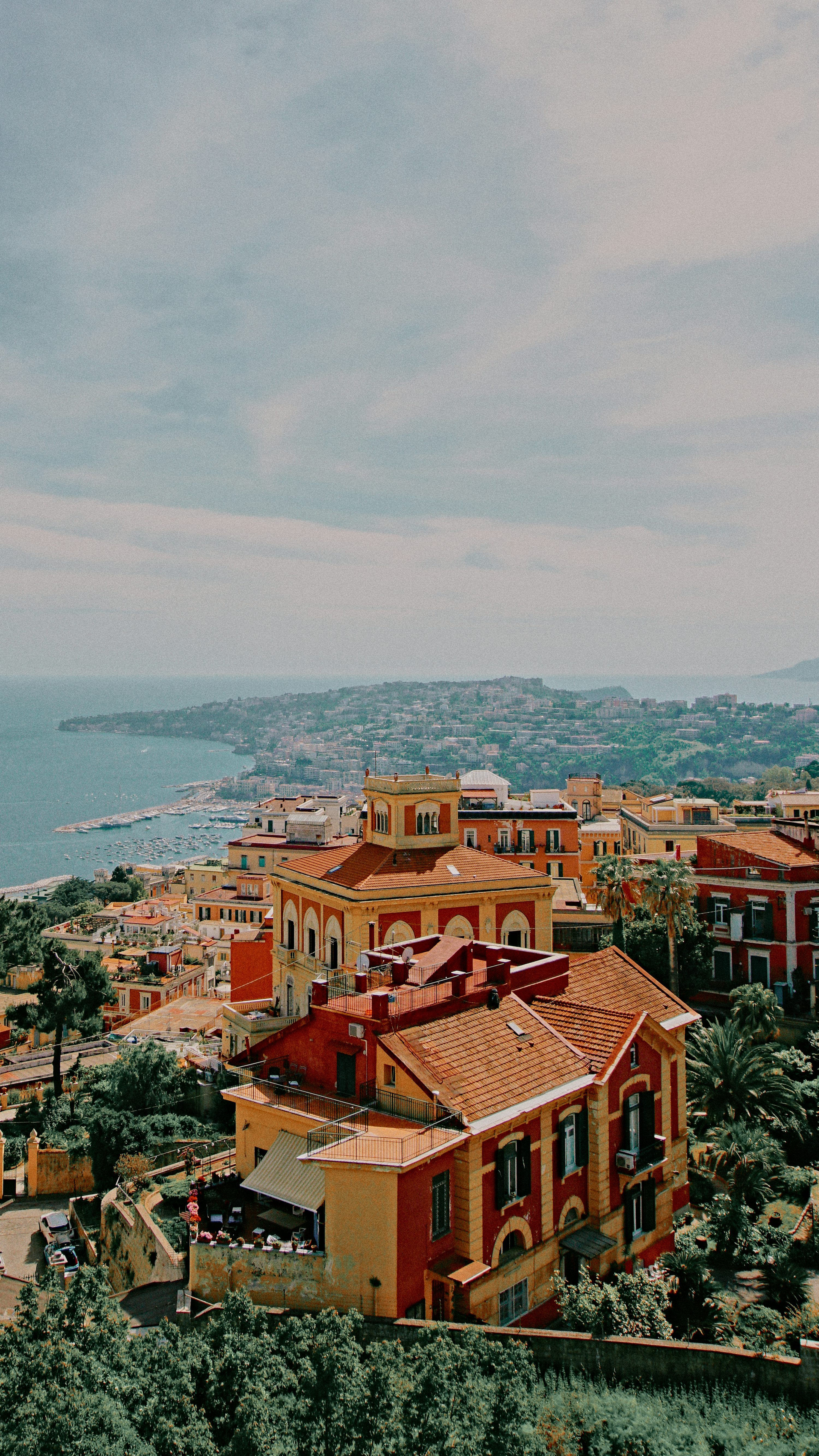 3000x5332 A view of a town with a body of water in the background photo