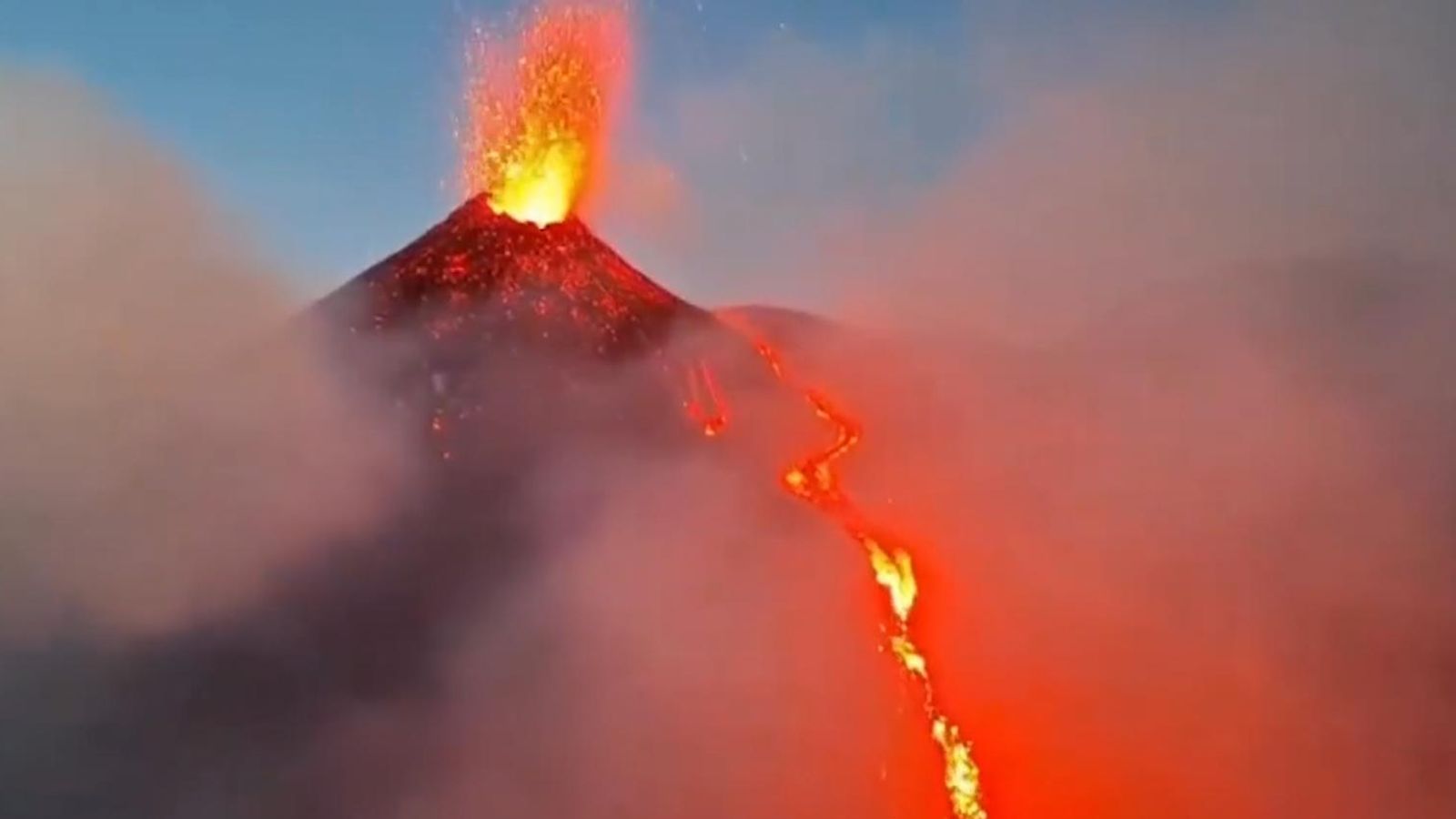 1600x900 This video captures a waterfall of lava flowing from one of Mount Etna's largest craters