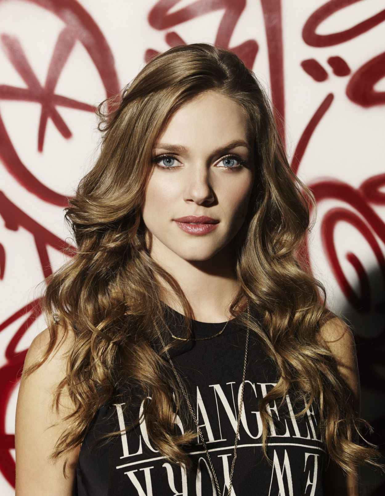 1250x1609 Tracy Spiridakos Portraitwith Graffiti Background Wallpaper