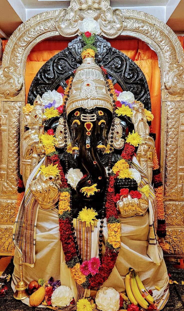 736x1243 Lord Ganesha Statue Surrounded by Flowers and Bananas. Lord ganesha and murugan, Ayyappa ganesh murugan