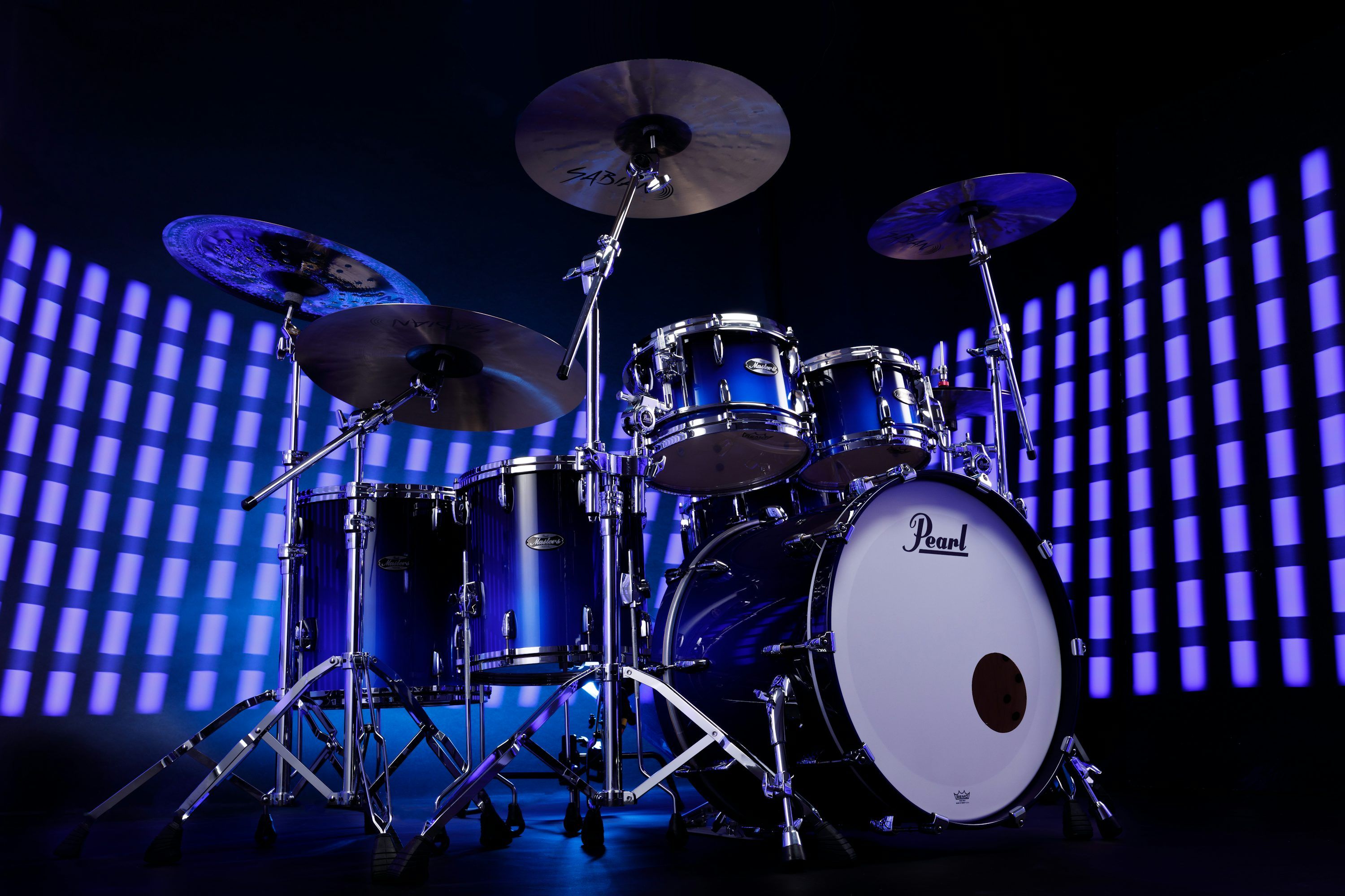 3000x2000 A drum set is shown in front of a blue background photo