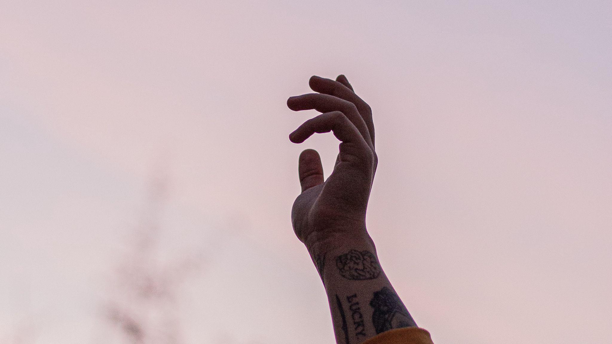 2048x1152 Download wallpaper 2048x1152 hand, fingers, tattoo, sky ultrawide