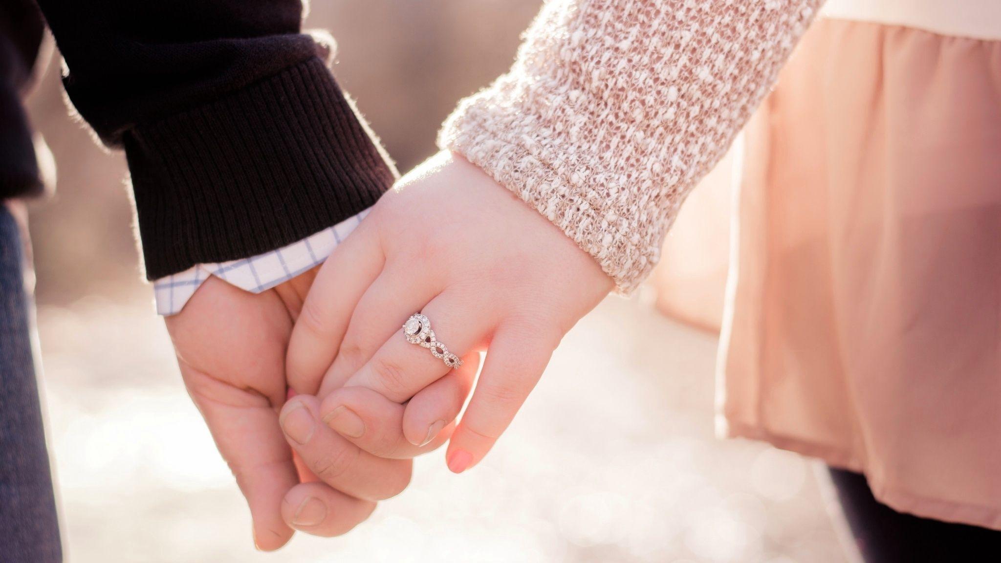 2048x1152 Couple Wearing Love Ring Wallpaper