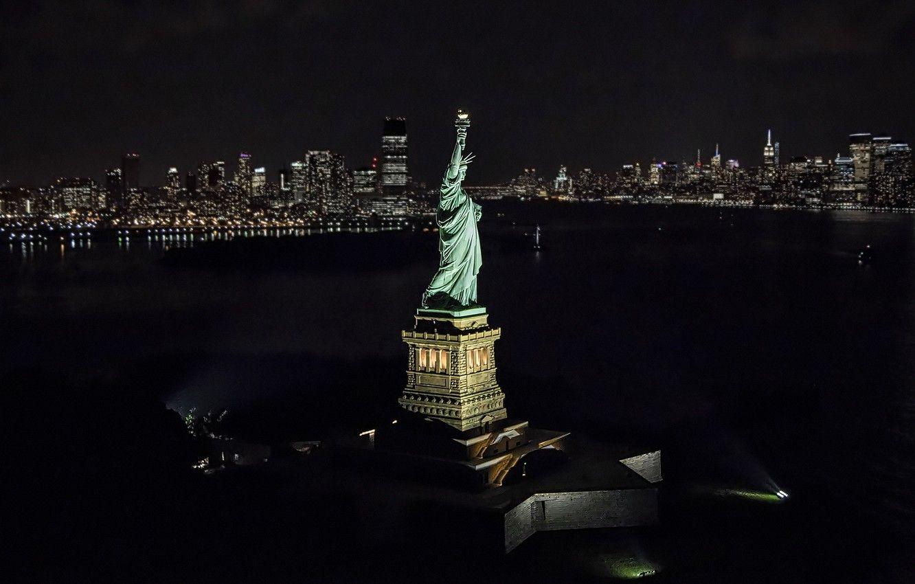Liberty statue night york aerial footage stock orbiting axiom