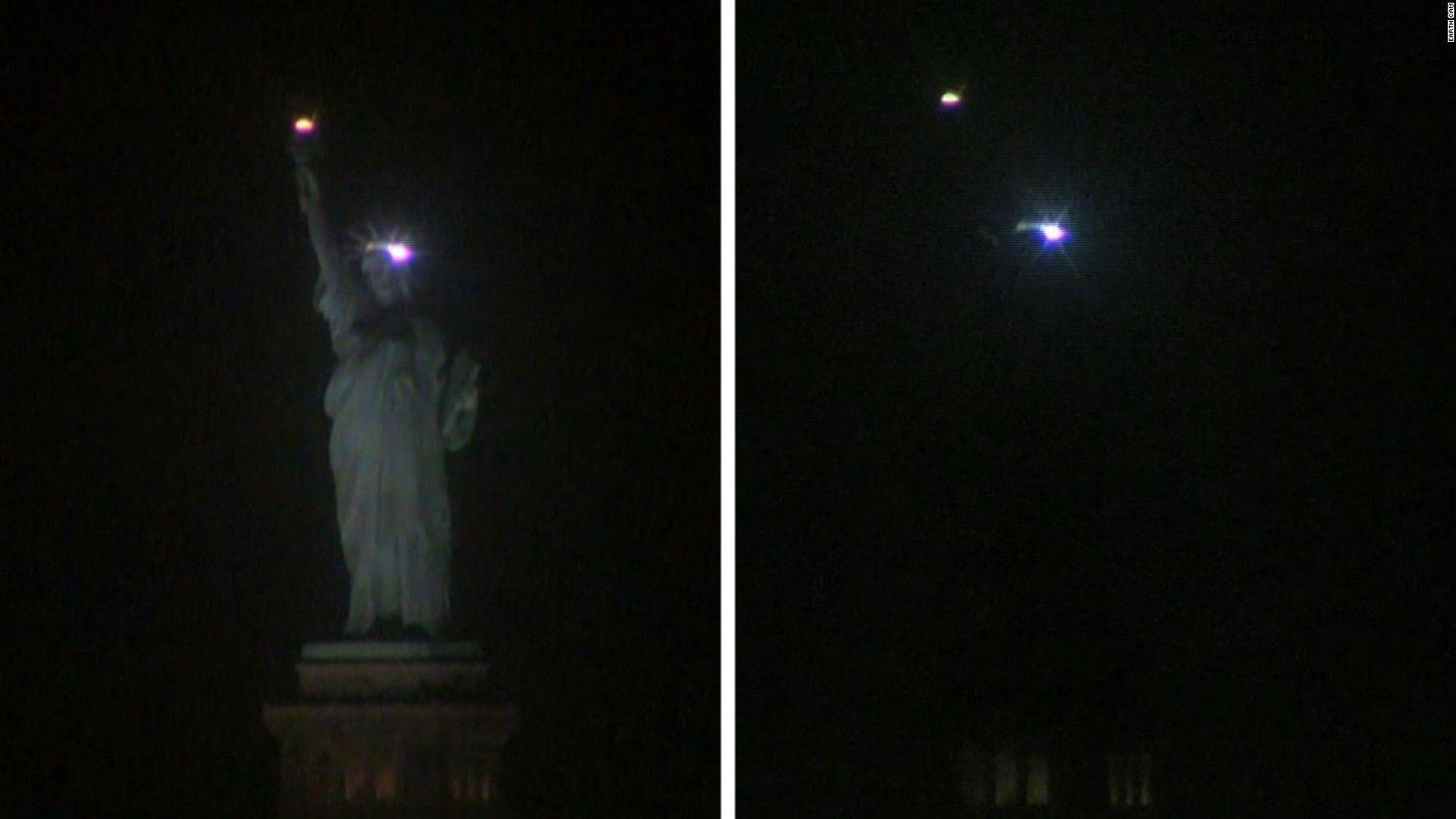 1600x900 Statue of Liberty goes dark, lights up - and the symbolism is not