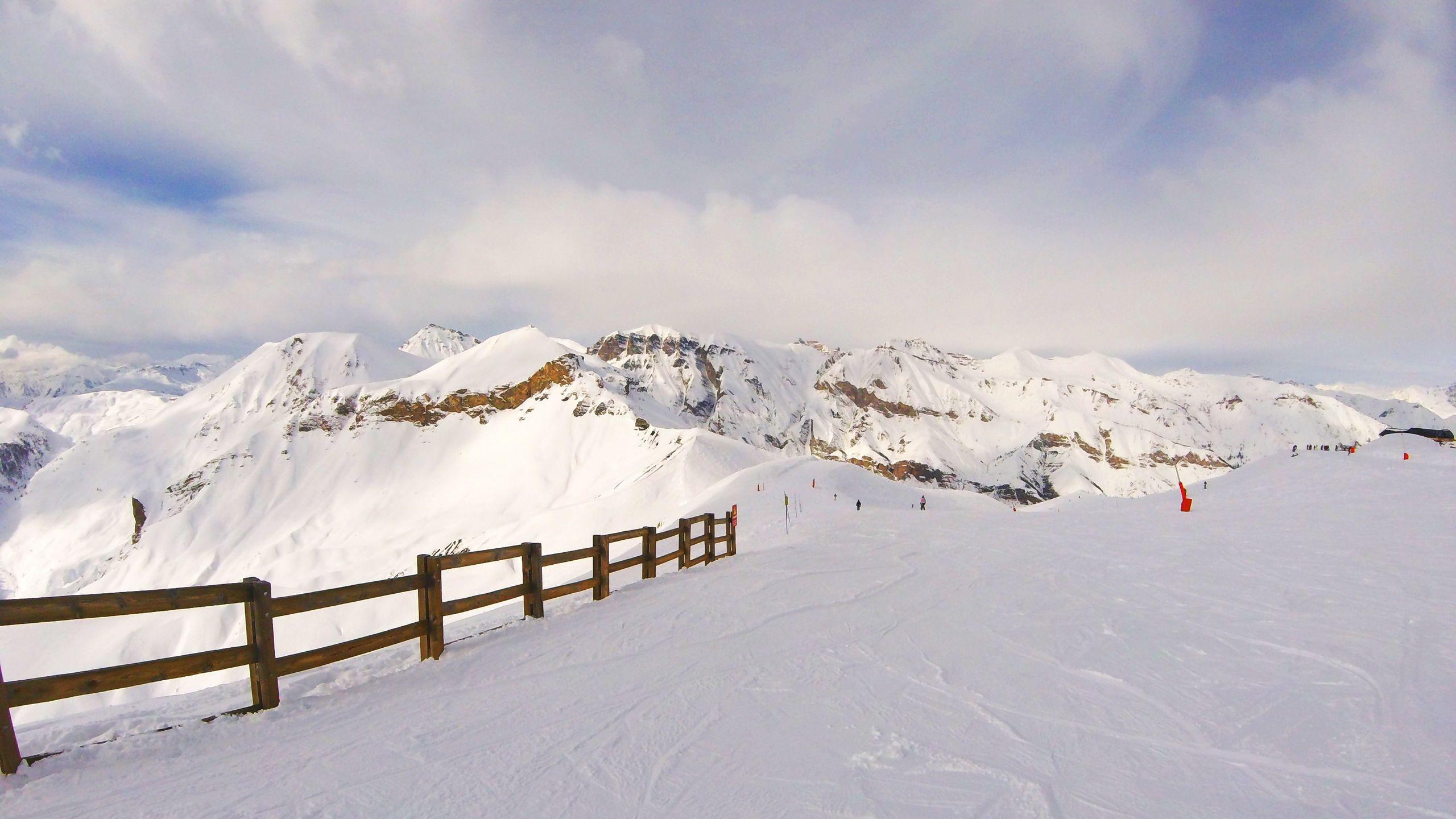 2560x1440 Download wallpaper 2560x1440 snow, mountains, summit, winter