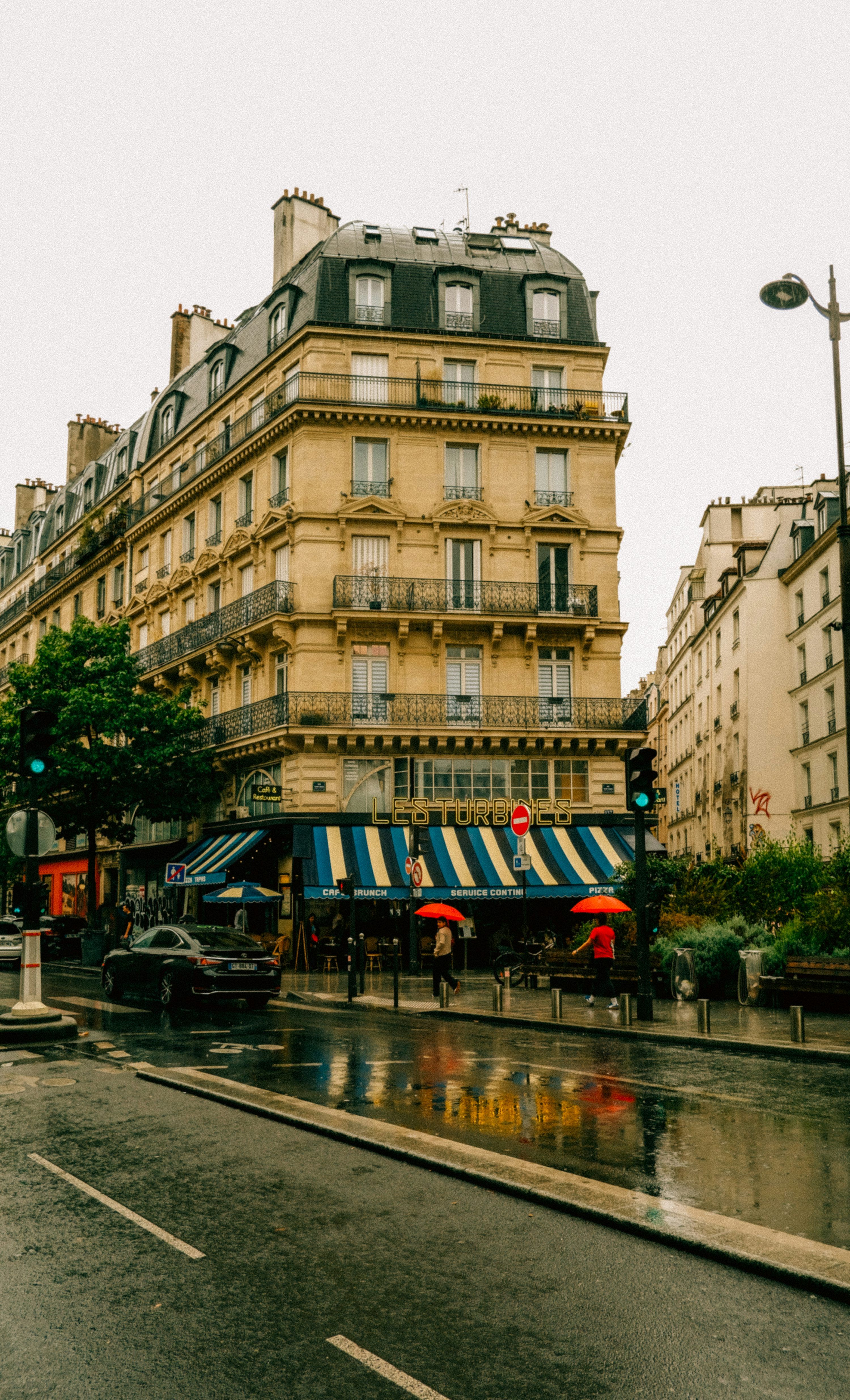 3000x4941 A rainy day in a city with buildings and umbrellas photo