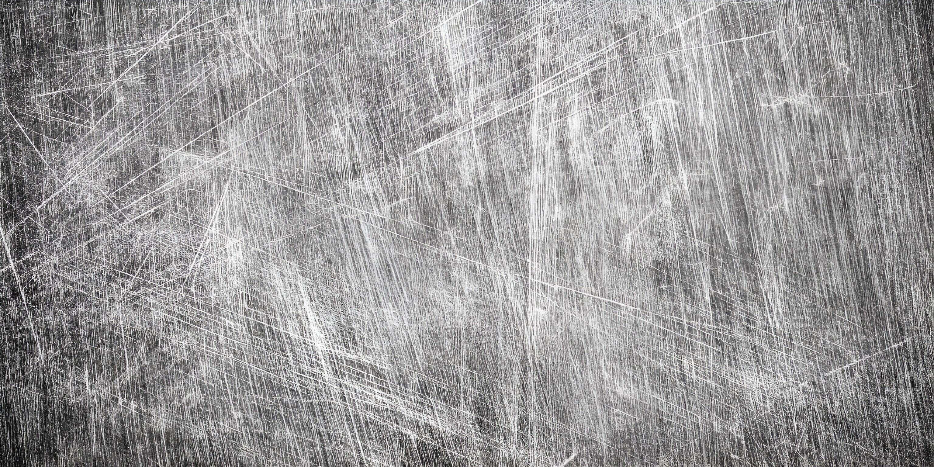 3072x1536 A close up view of a heavily scratched and worn metal surface displaying a grunge texture
