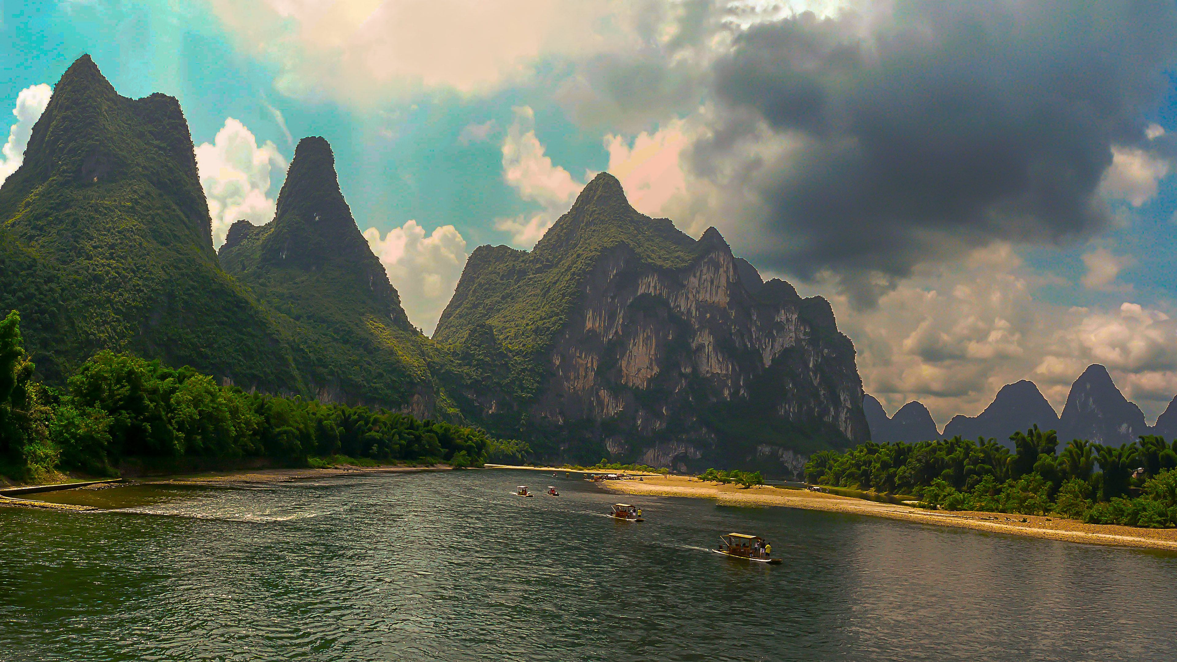 3840x2160 Wallpaper People Riding Boat on Sea Near Mountain During Daytime, Background Free Image