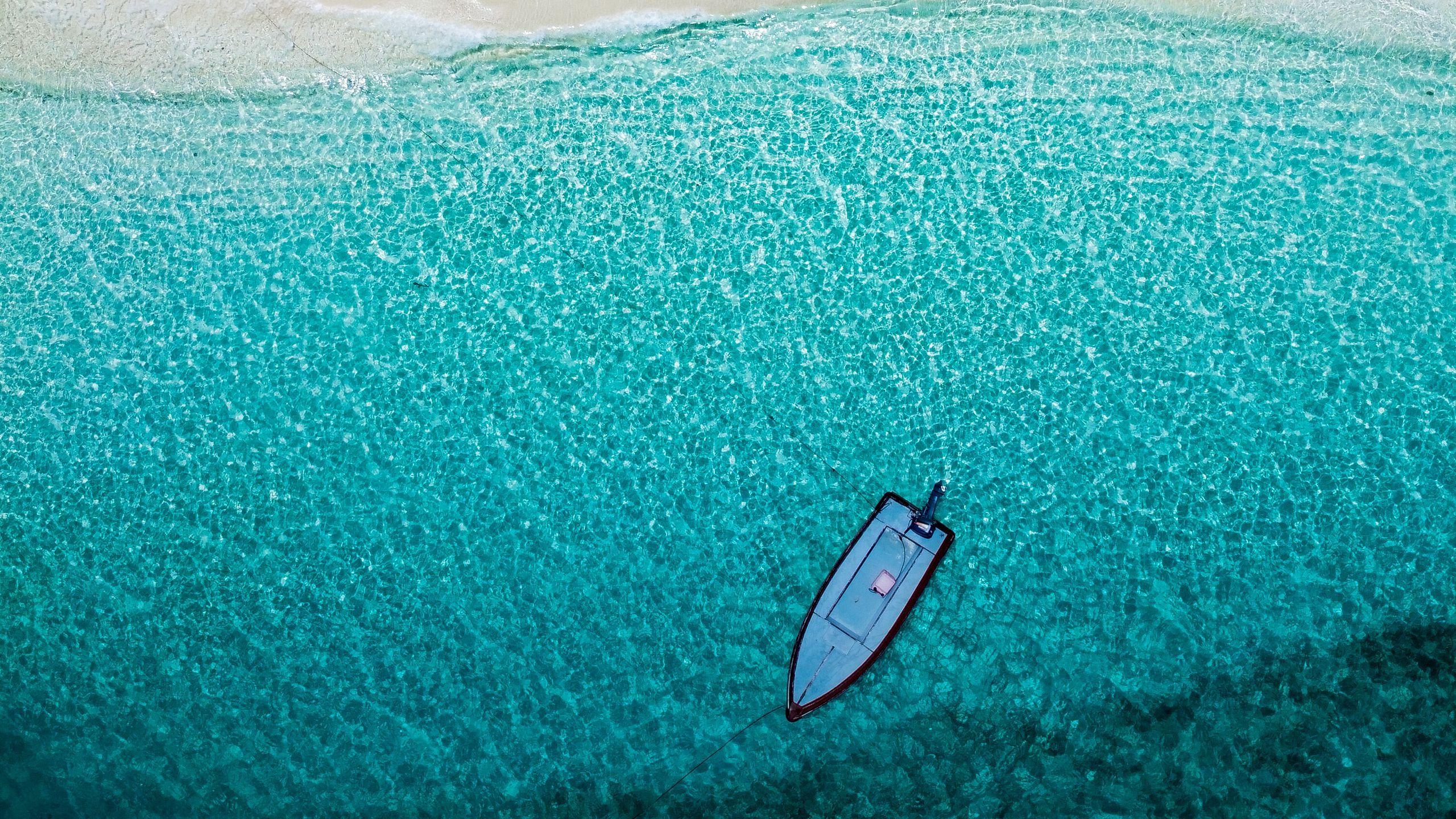 2560x1440 Download wallpaper 2560x1440 sea, beach, aerial view, boat, water