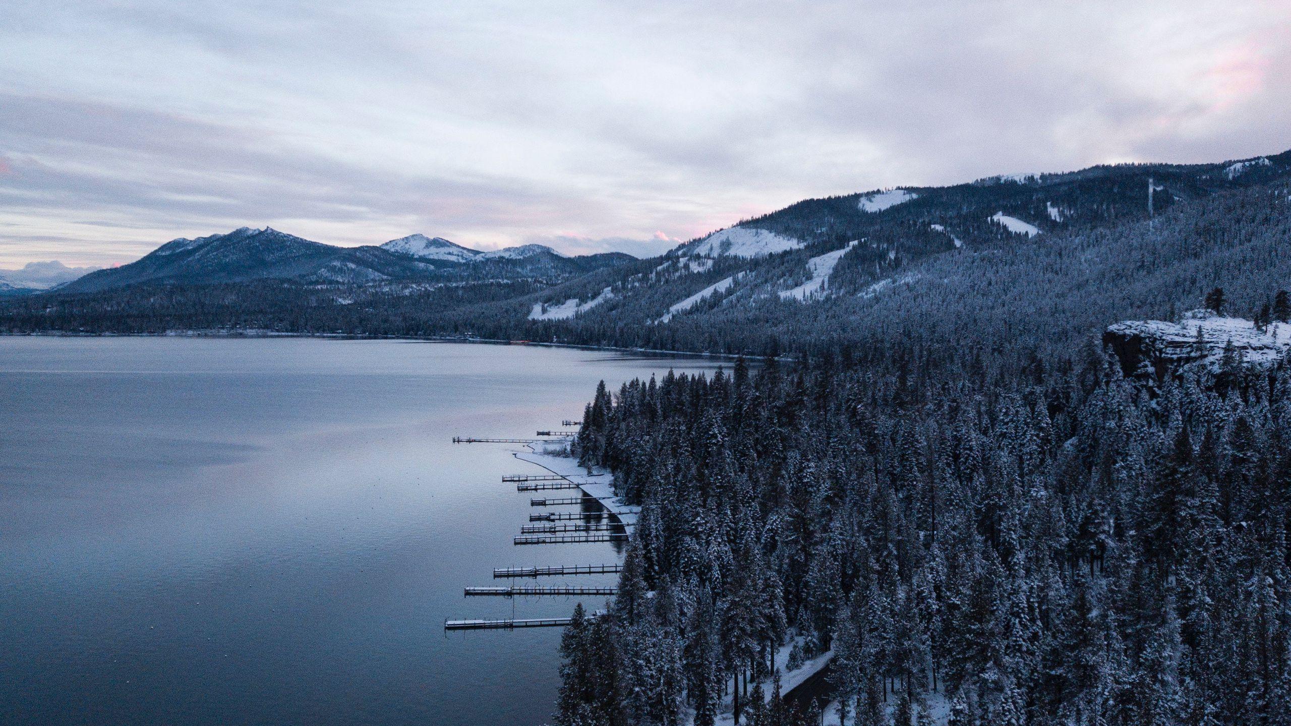 2560x1440 Download wallpaper 2560x1440 lake, mountains, winter, snow, road