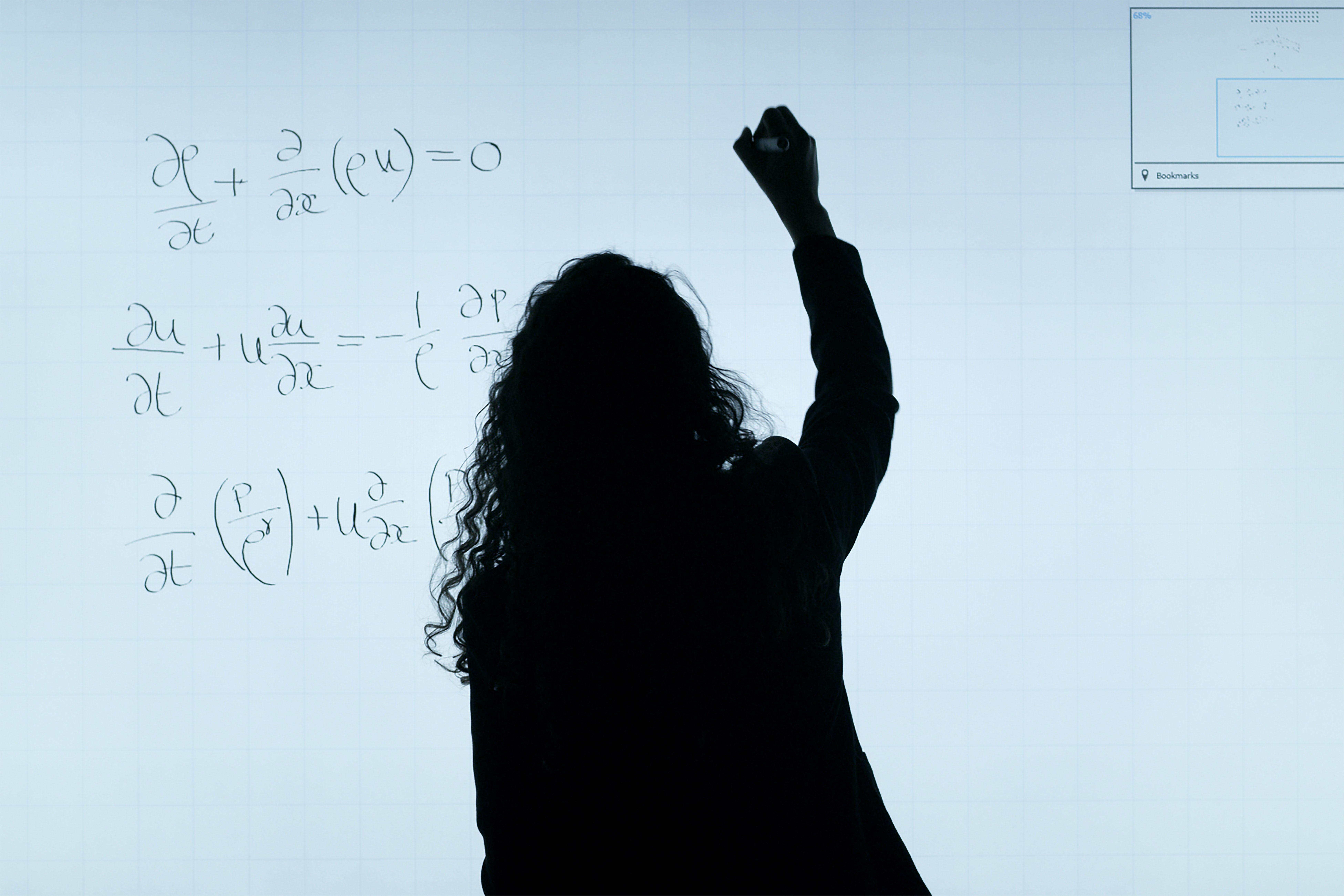 7804x5205 Woman Writing On A Whiteboard · Free