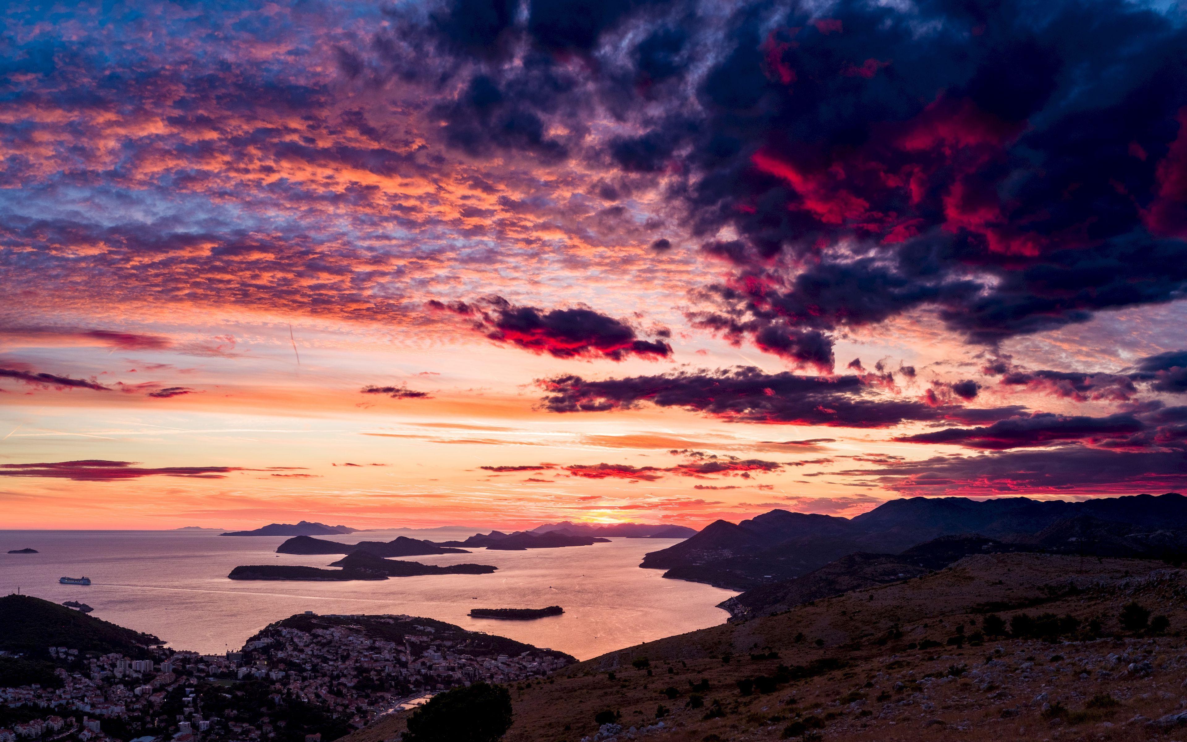 3840x2400 Download wallpaper 3840x2400 sea, sunset, clouds, mountains