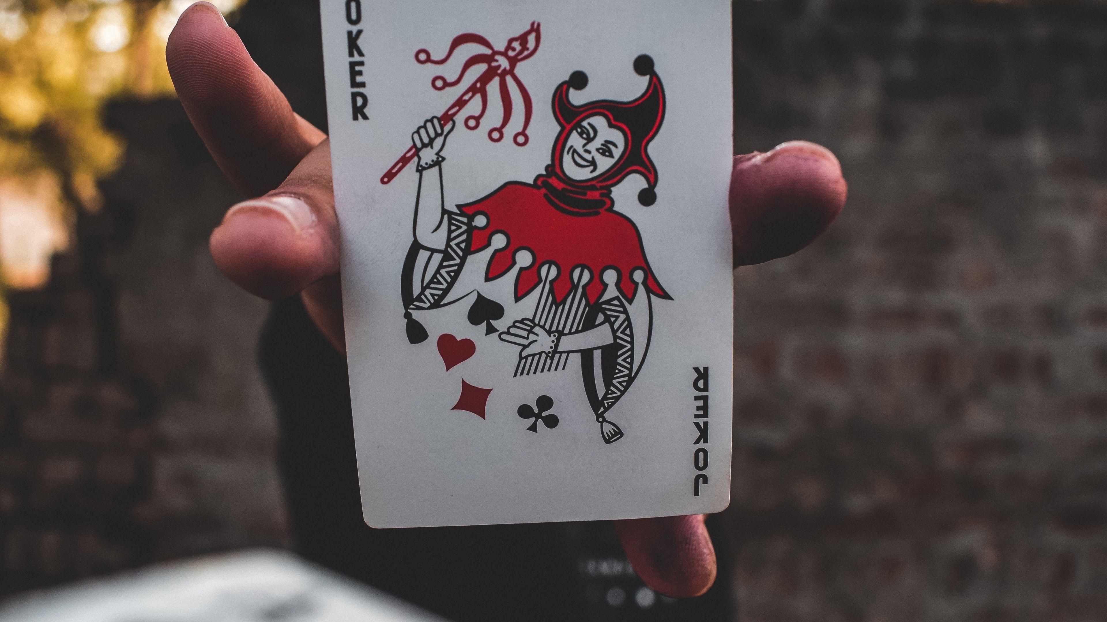 3840x2160 Download wallpaper 3840x2160 joker, card, fingers, hand 4k uhd 16