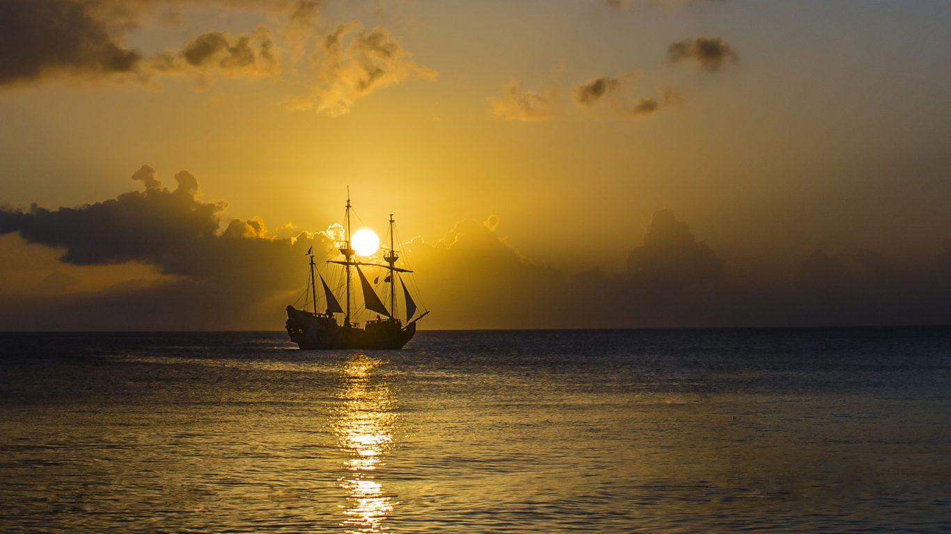 1366x768 Gold Sunset Ocean Old Pirate Ship With Sail Sky 4k Ultra HD