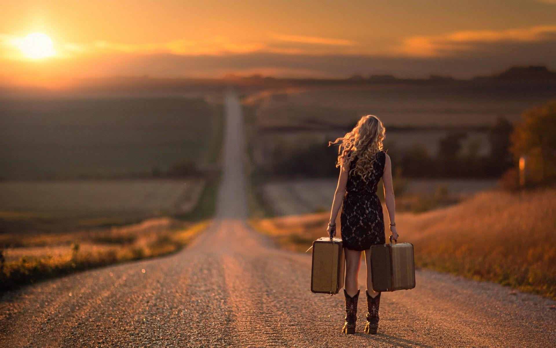 1920x1200 Moving On, Woman with Luggage on a Desert Road widescreen wallpaper