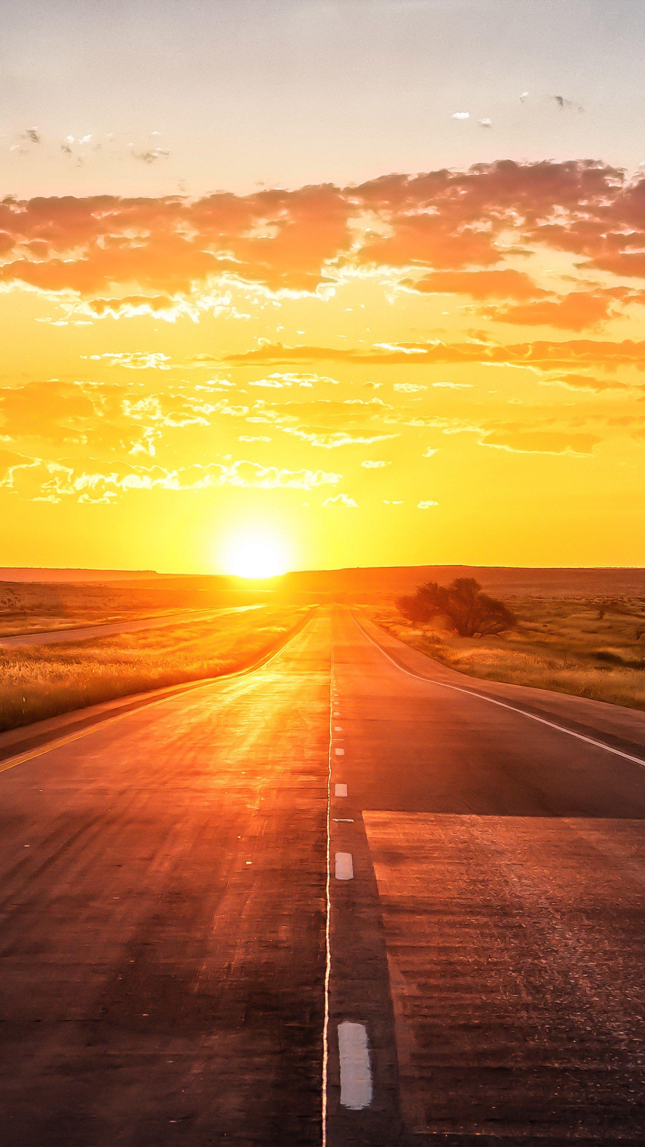 2160x3840 Straight Road Sunset Marking Grass 4K Ultra HD Mobile Wallpaper