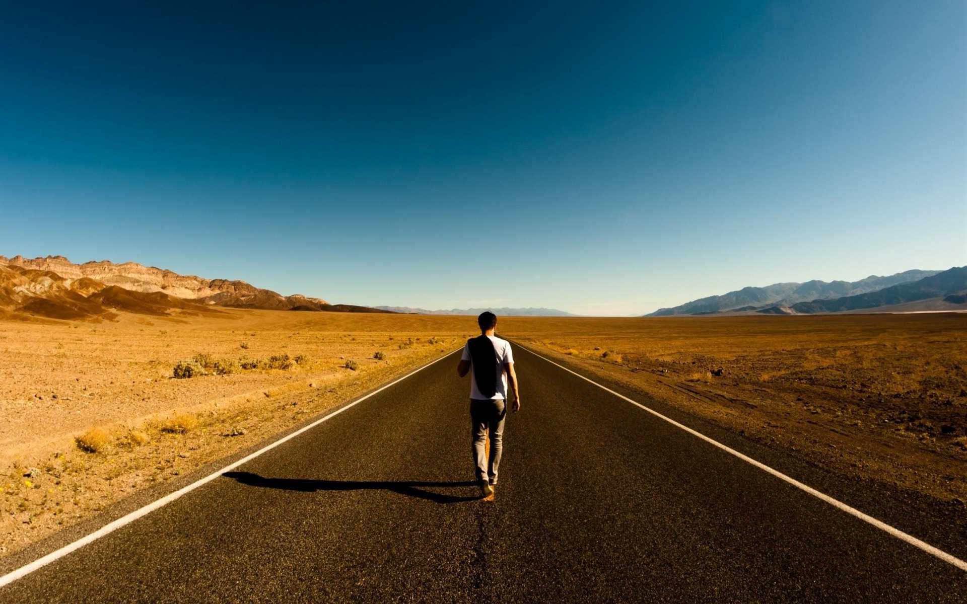 Download A Lonely Man Walking Wallpaper | Wallpapers.com