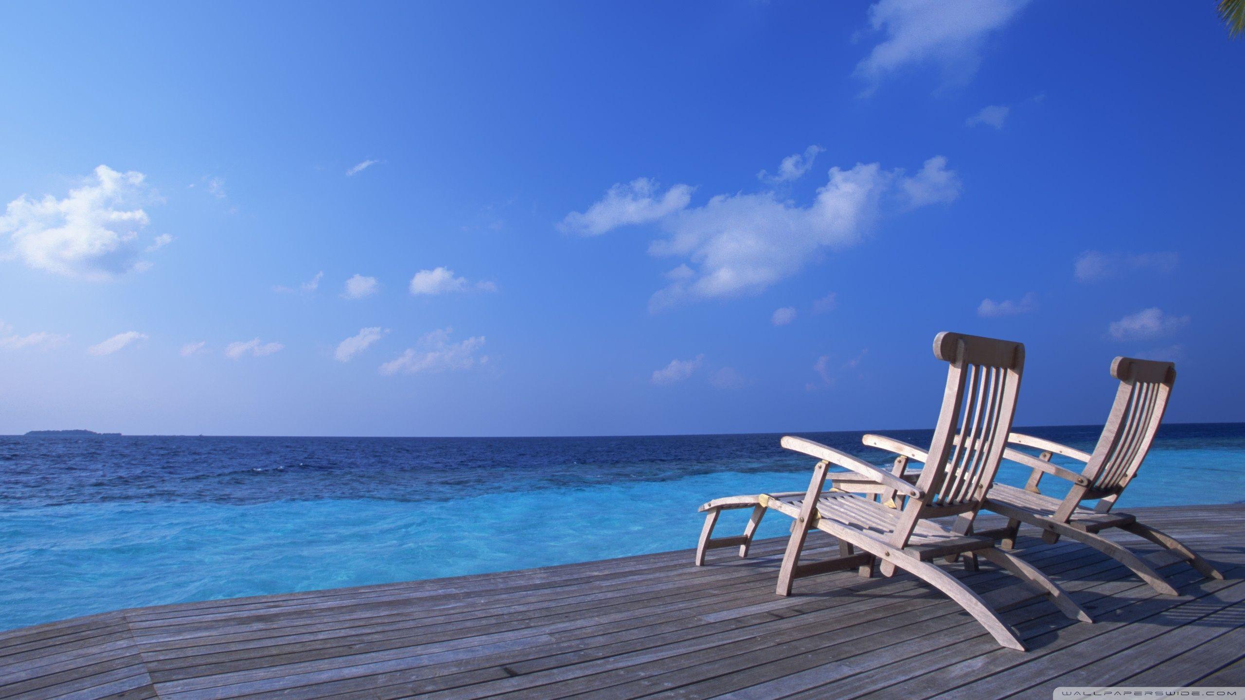 2560x1440 Canvas Chairs On Tropical Island Ultra HD Desktop Background