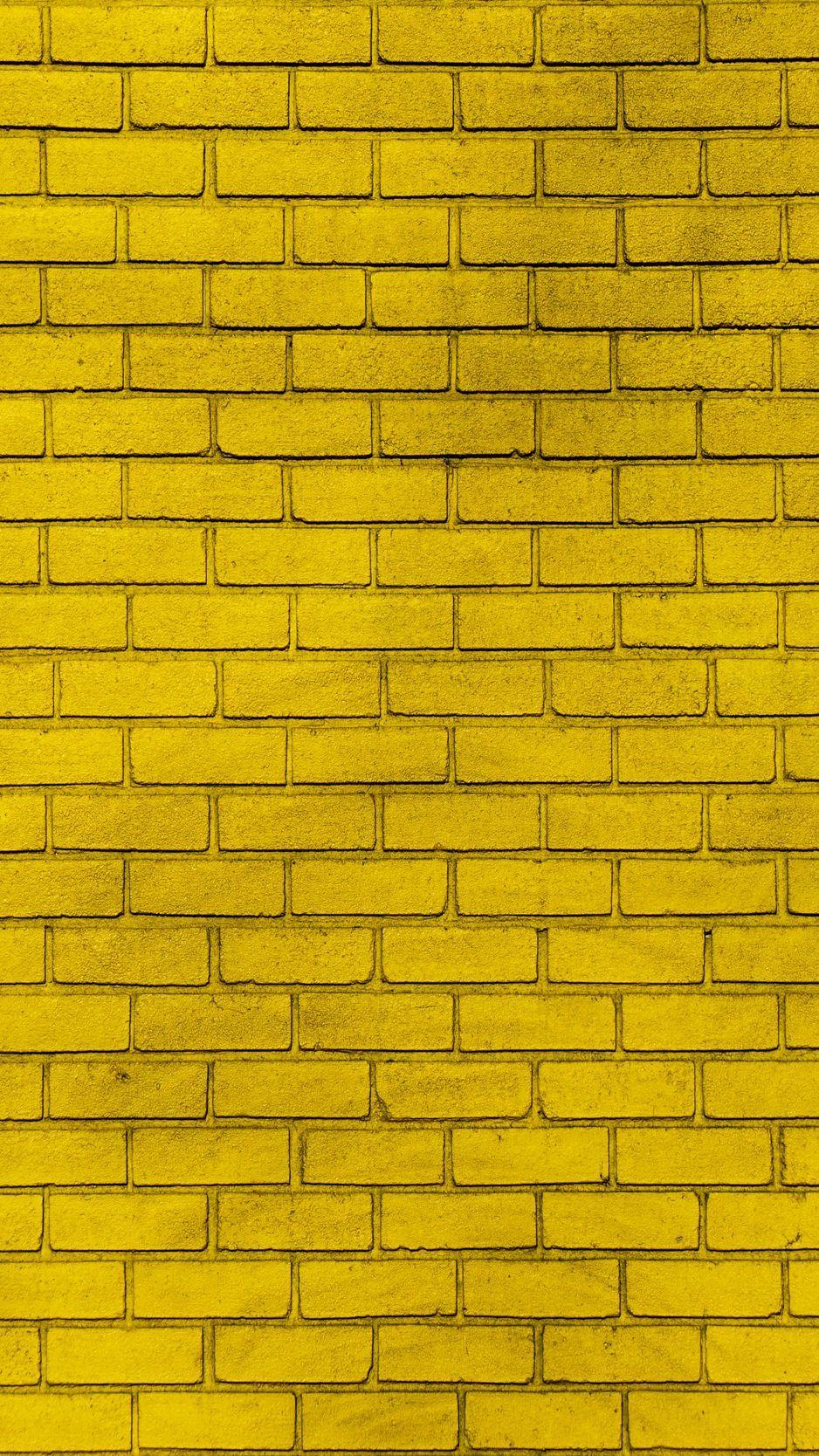938x1668 Download wallpaper 938x1668 wall, brick, yellow, paint, texture