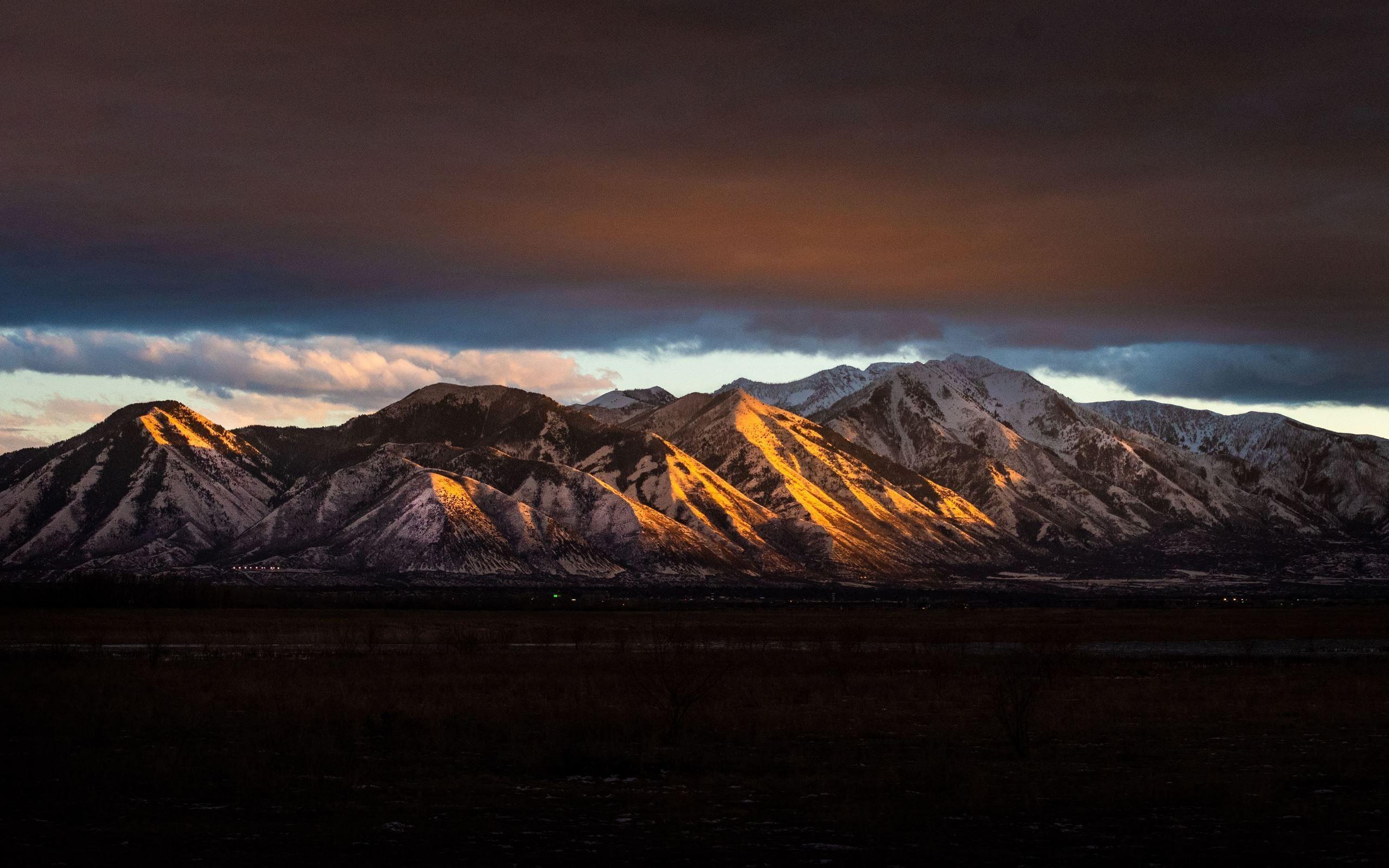2560x1600 brown white mountains under sky 5k iMac Wallpaper Download