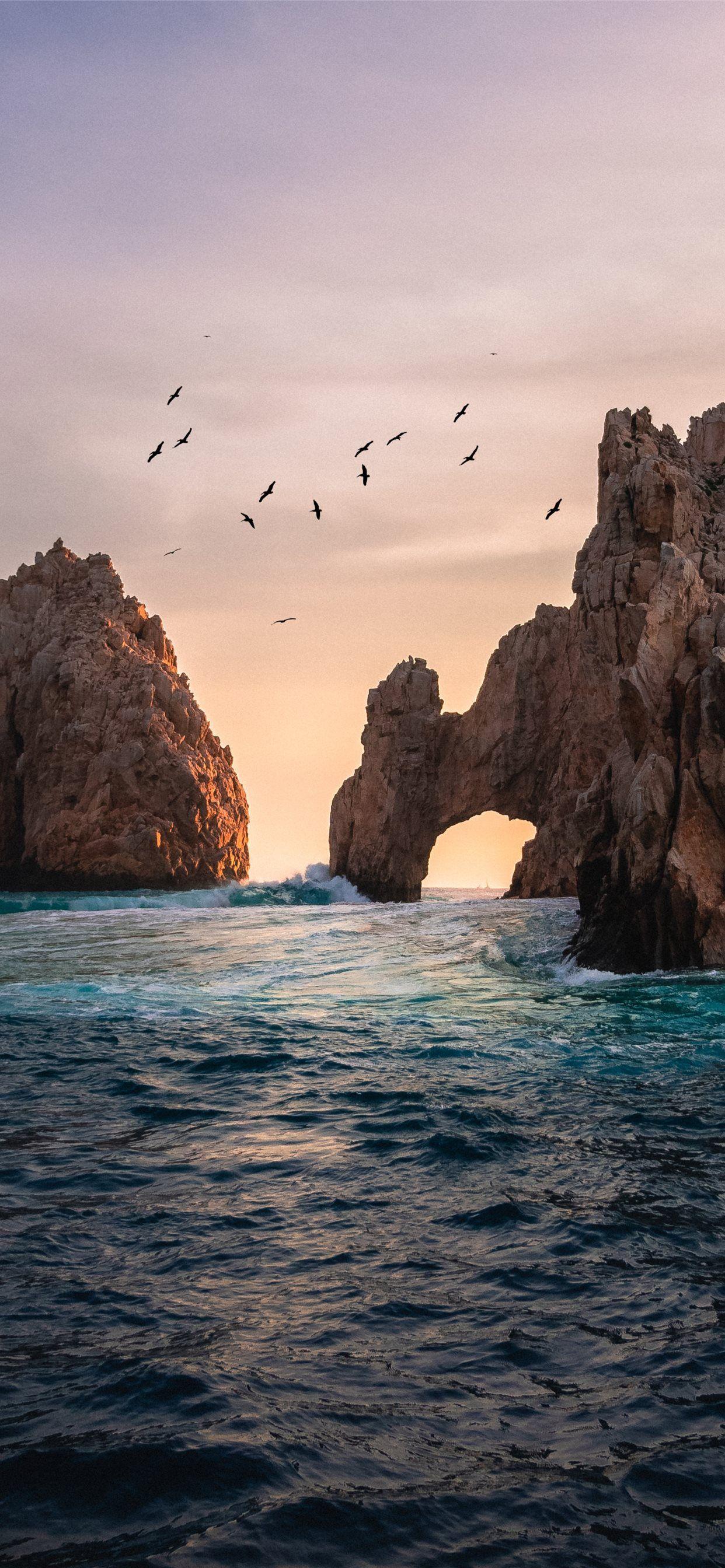 1242x2688 rock formation on the ocean photography iPhone X Wallpaper Free