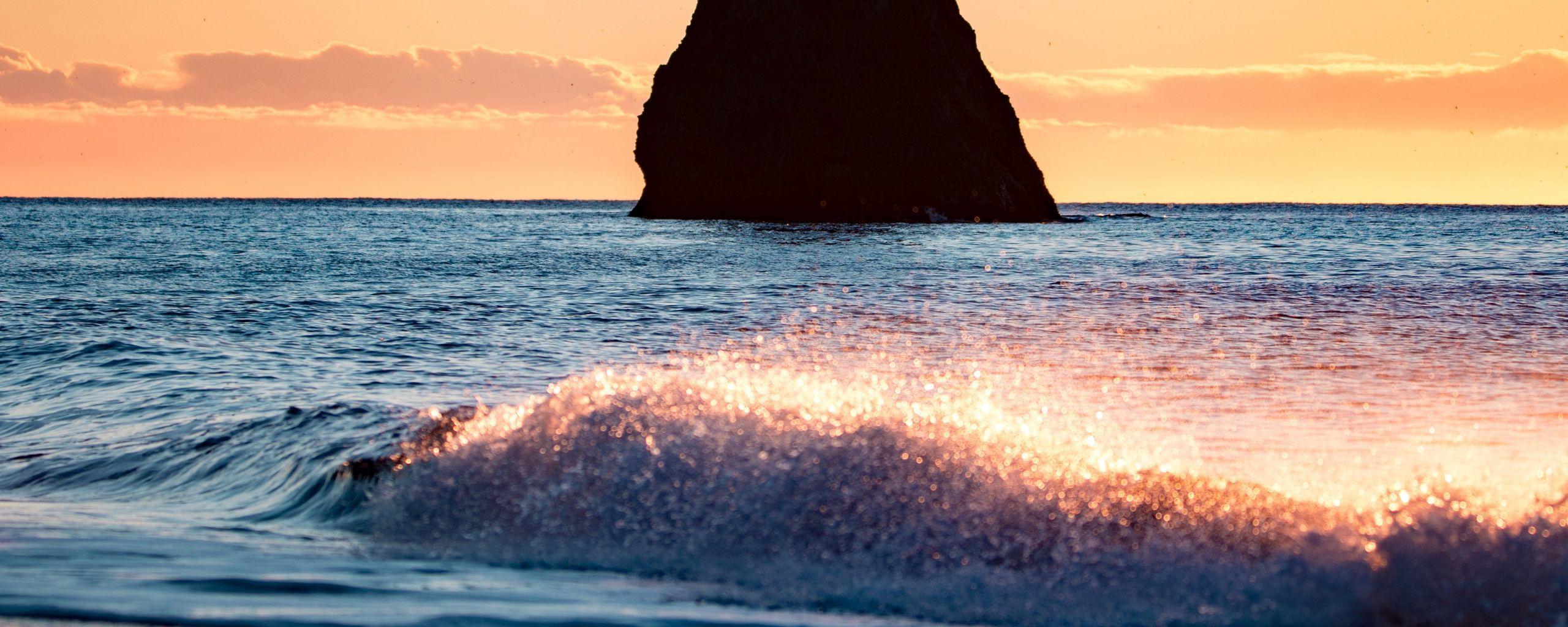 2560x1024 Download wallpaper 2560x1024 rock, sea, waves, coast, beach