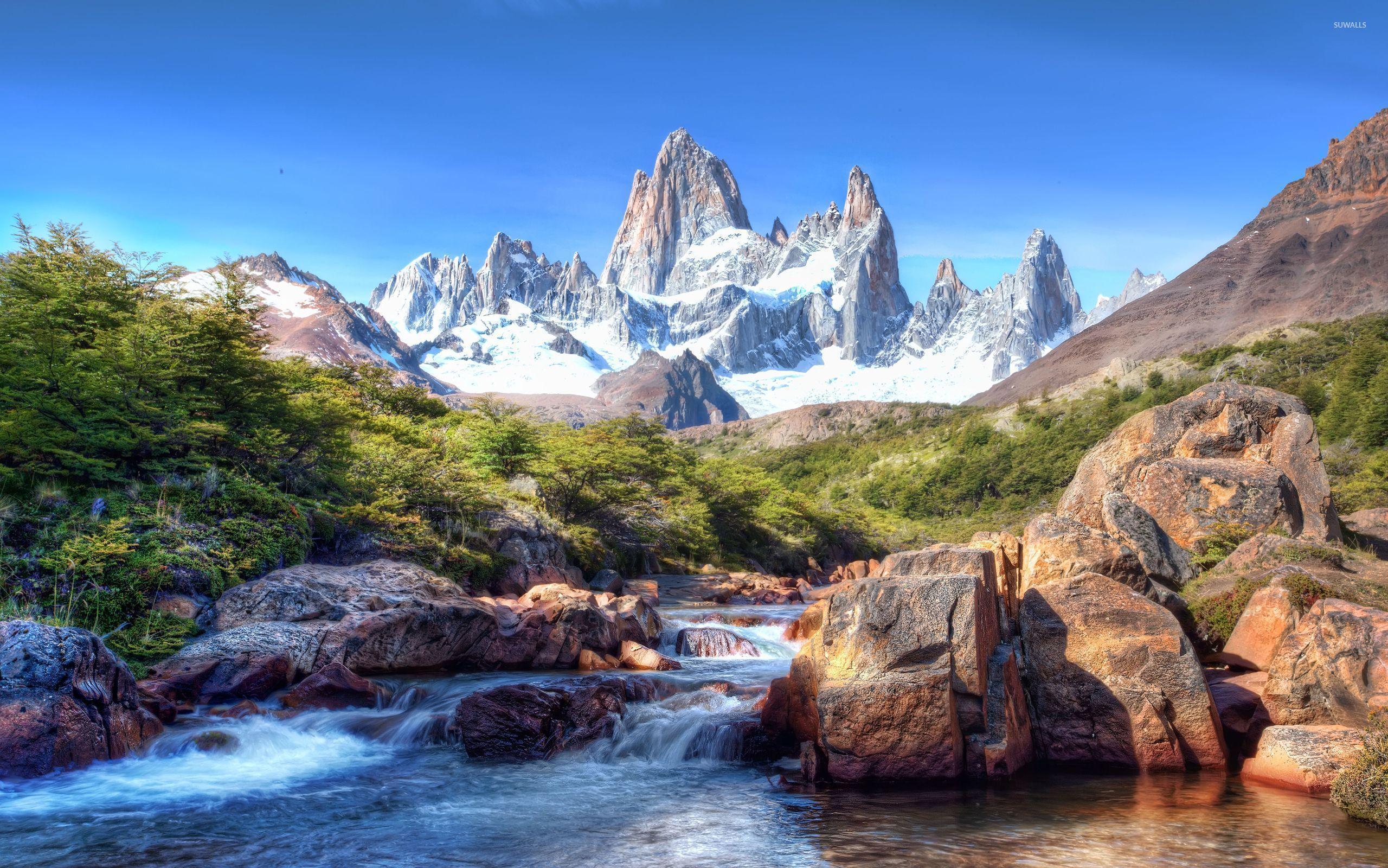 2560x1600 Rocky waterfall in front of the amazing rocky mountains wallpaper