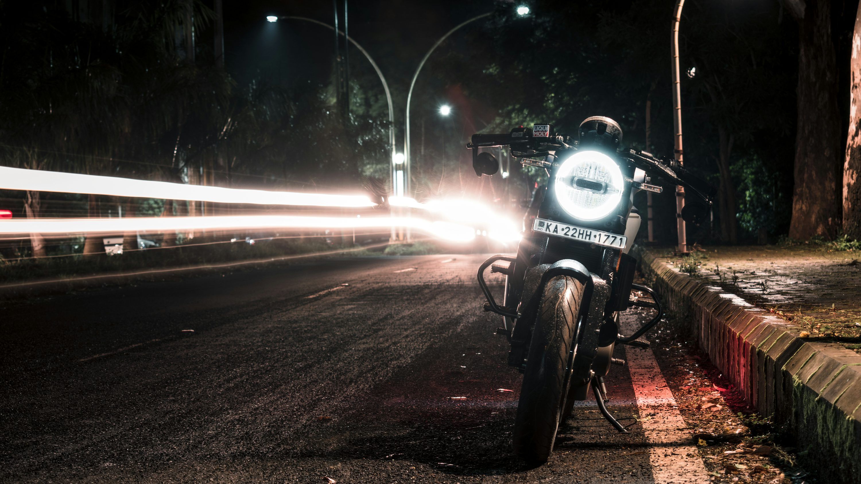 3000x1688 Black motorcycle on road during night time photo